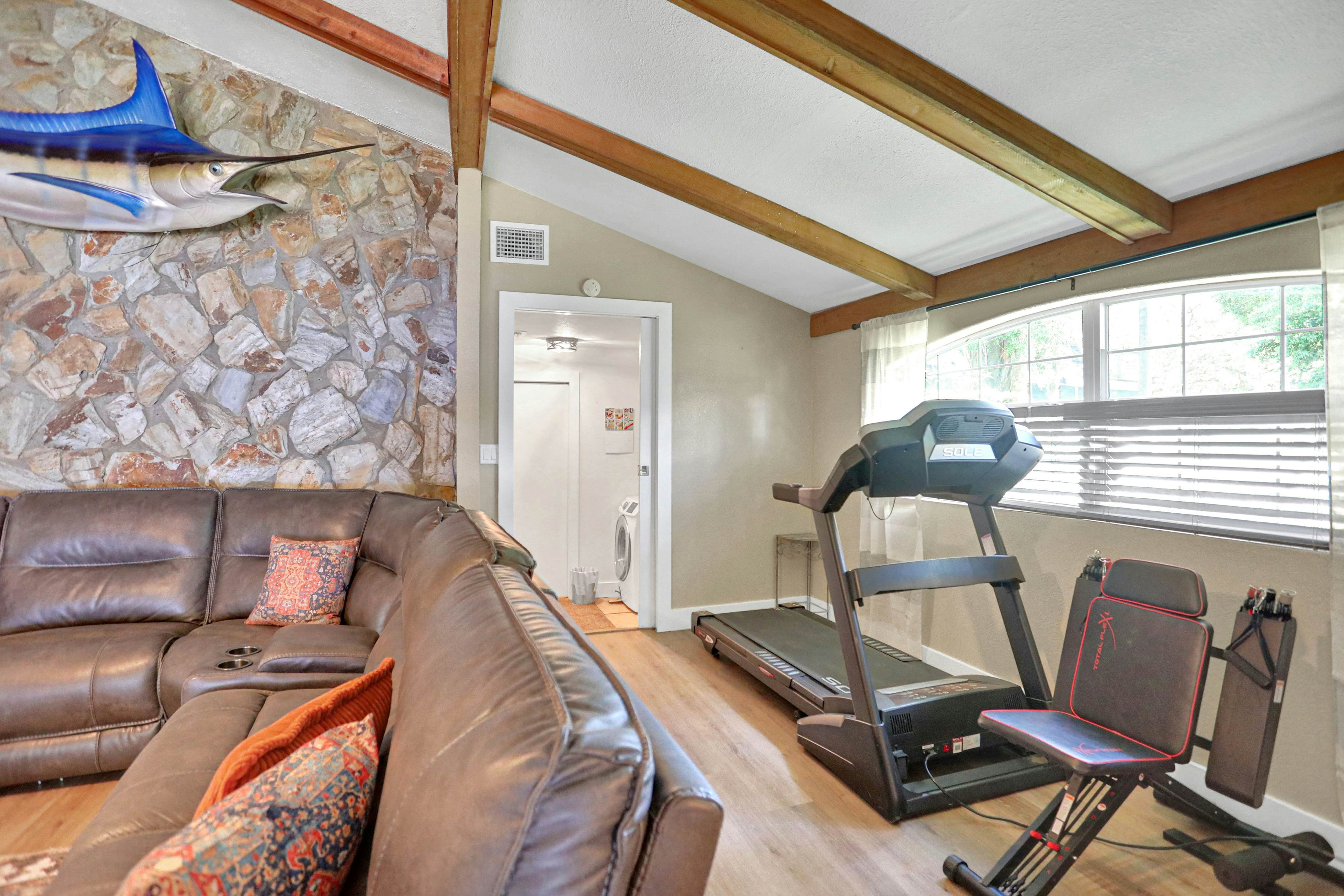 Riverfront retreat with pool/spa, outdoor kitchen, firepit, dock, sauna & games