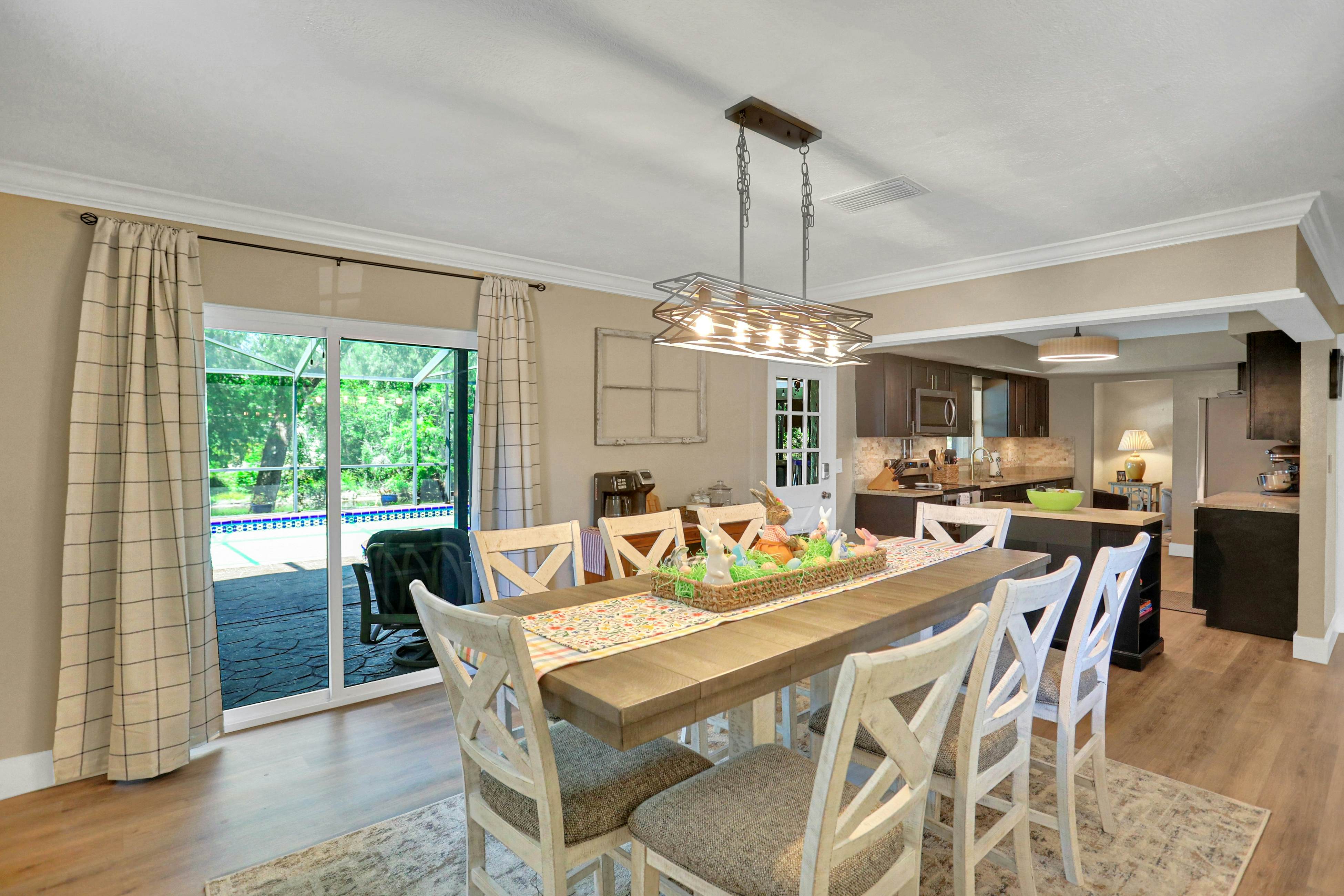 Riverfront retreat with pool/spa, outdoor kitchen, firepit, dock, sauna & games