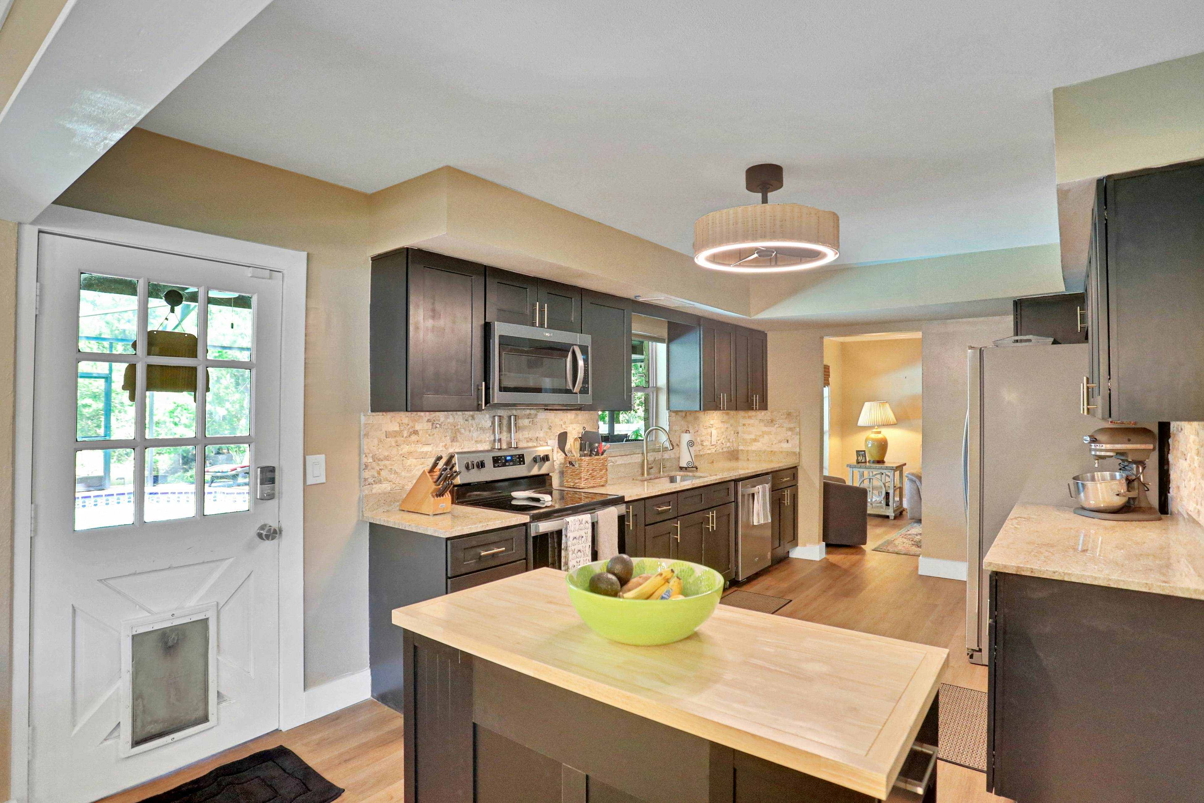 Riverfront retreat with pool/spa, outdoor kitchen, firepit, dock, sauna & games