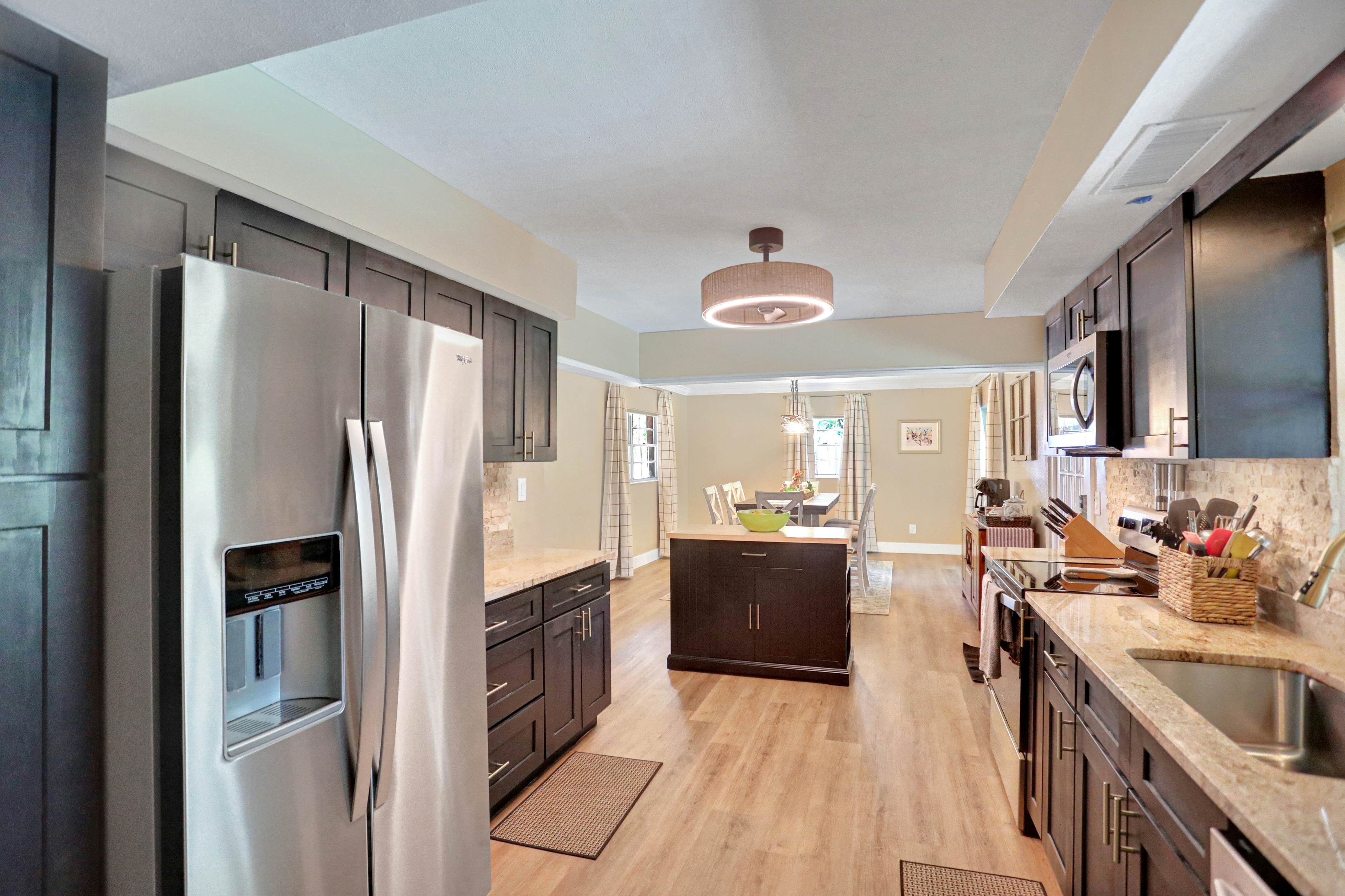 Riverfront retreat with pool/spa, outdoor kitchen, firepit, dock, sauna & games