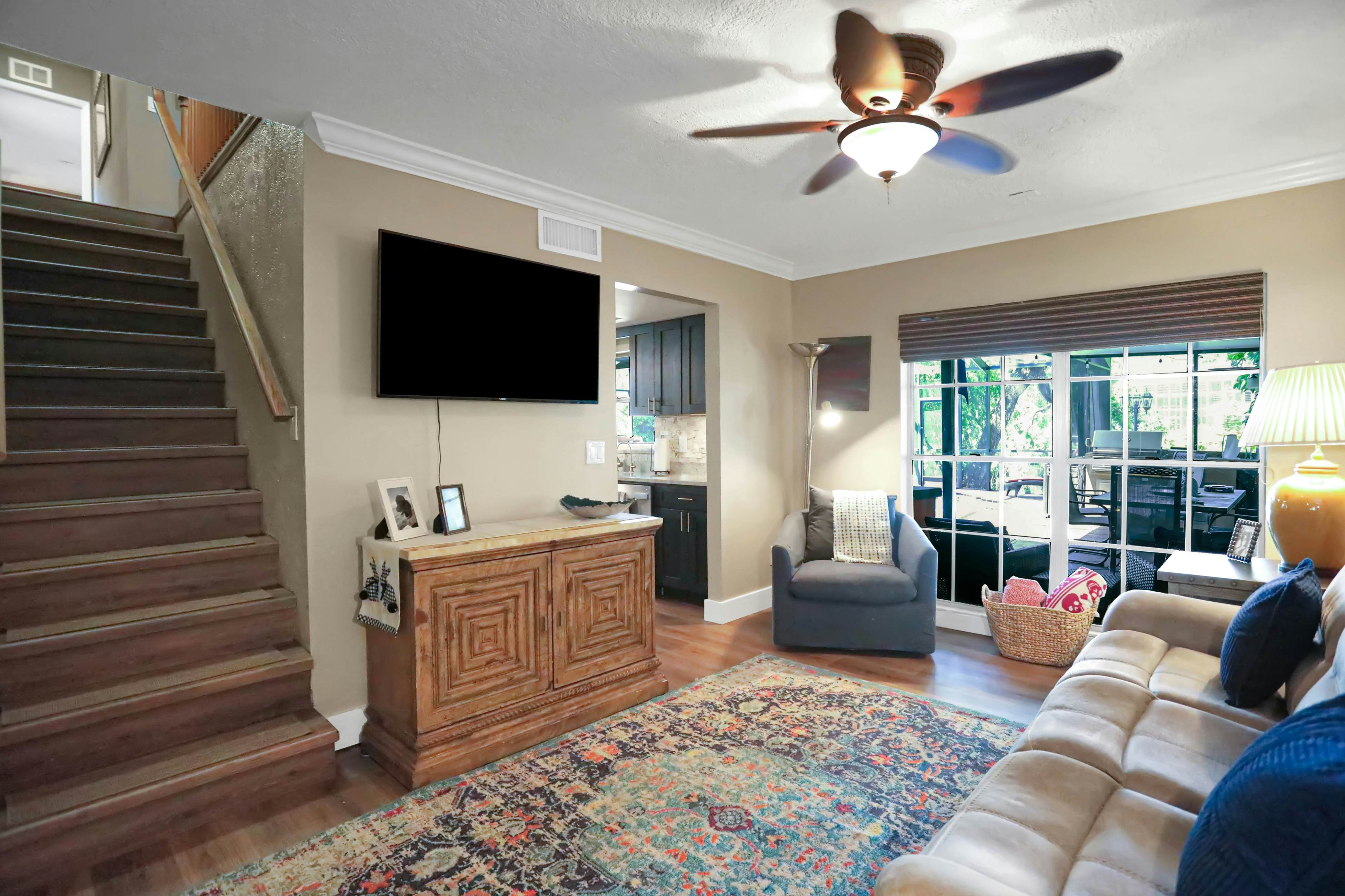 Riverfront retreat with pool/spa, outdoor kitchen, firepit, dock, sauna & games