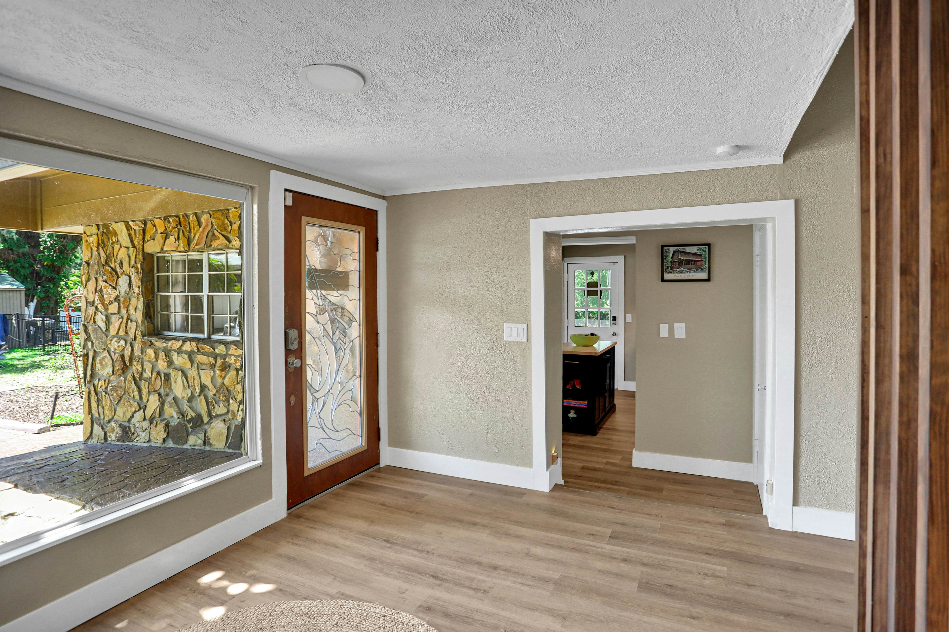 Riverfront retreat with pool/spa, outdoor kitchen, firepit, dock, sauna & games