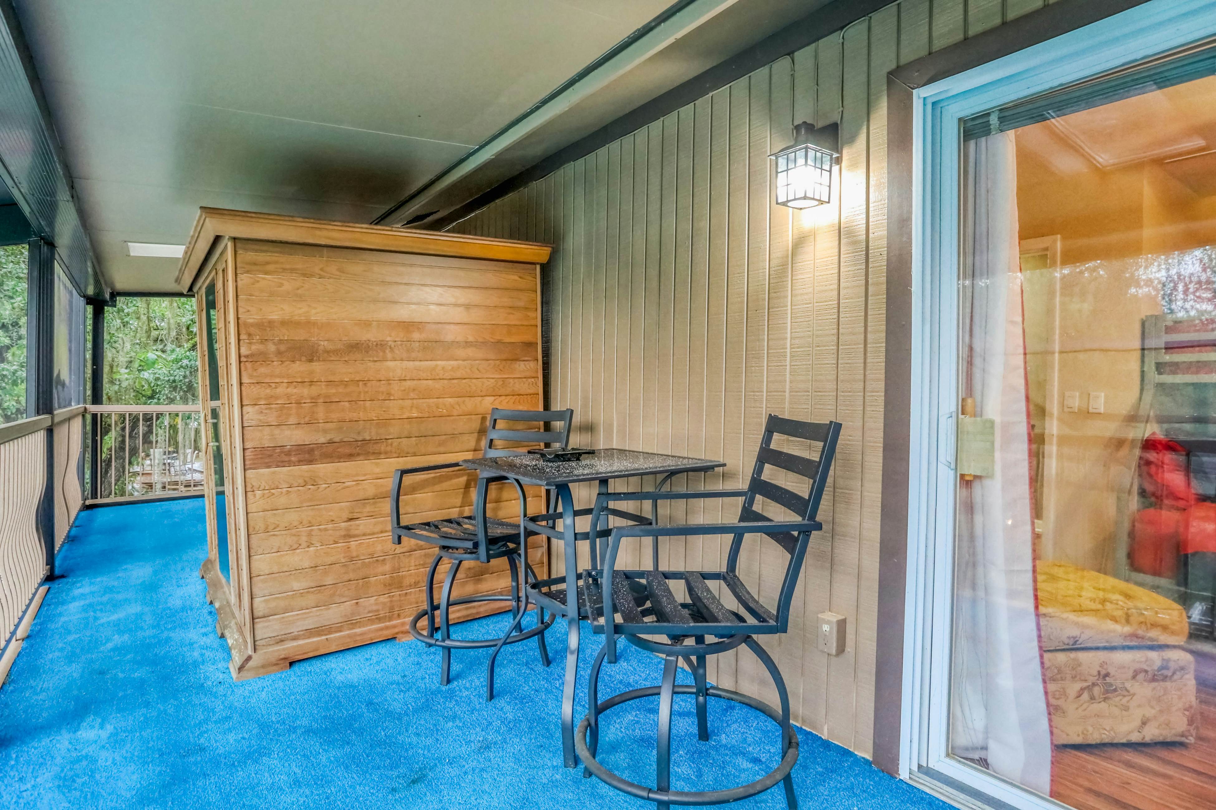 Riverfront retreat with pool/spa, outdoor kitchen, firepit, dock, sauna & games