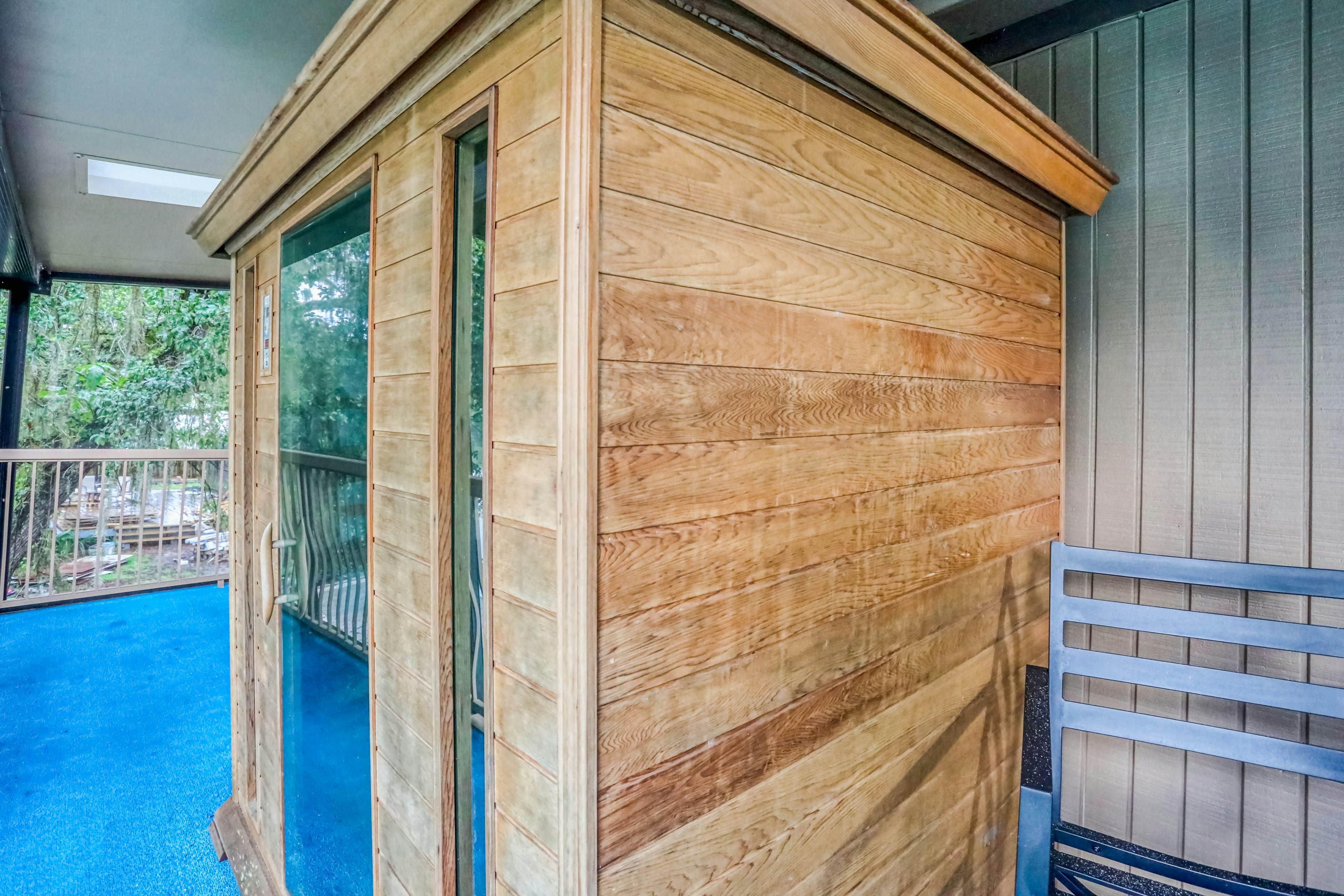 Riverfront retreat with pool/spa, outdoor kitchen, firepit, dock, sauna & games