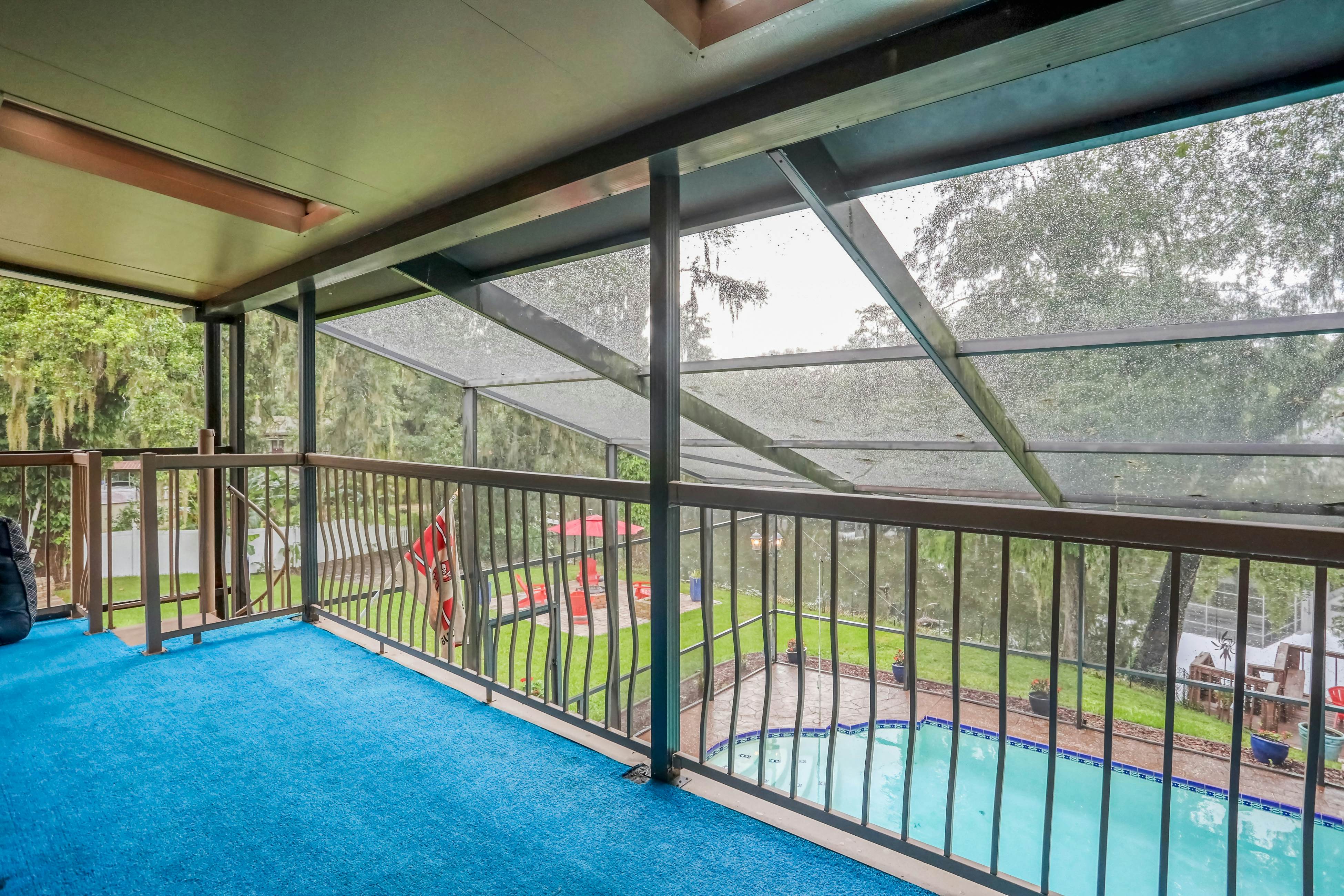 Riverfront retreat with pool/spa, outdoor kitchen, firepit, dock, sauna & games