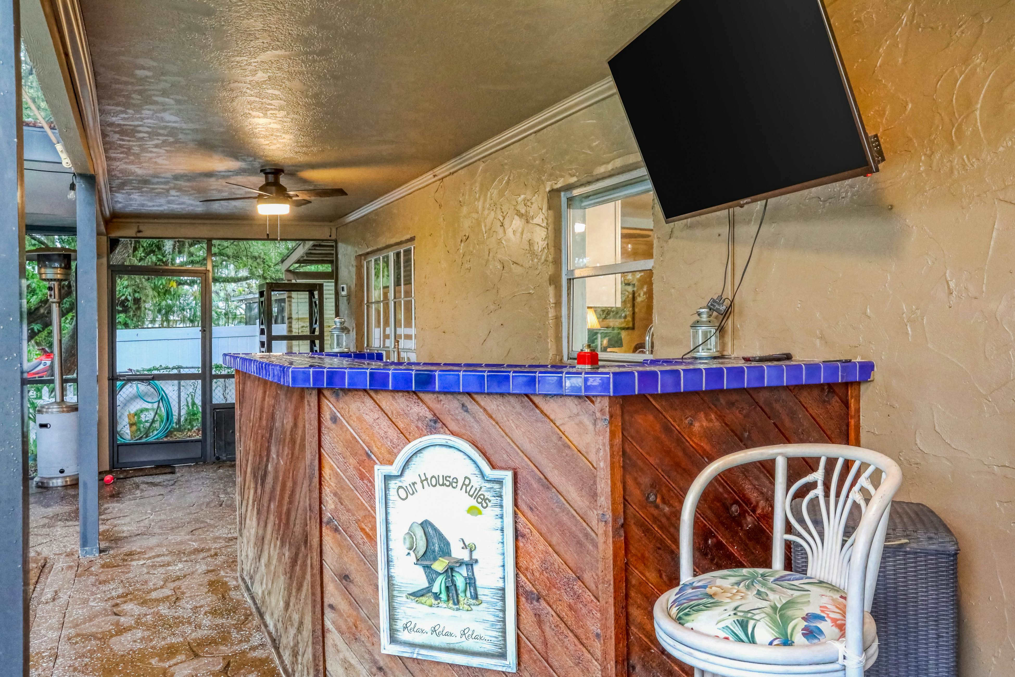 Riverfront retreat with pool/spa, outdoor kitchen, firepit, dock, sauna & games