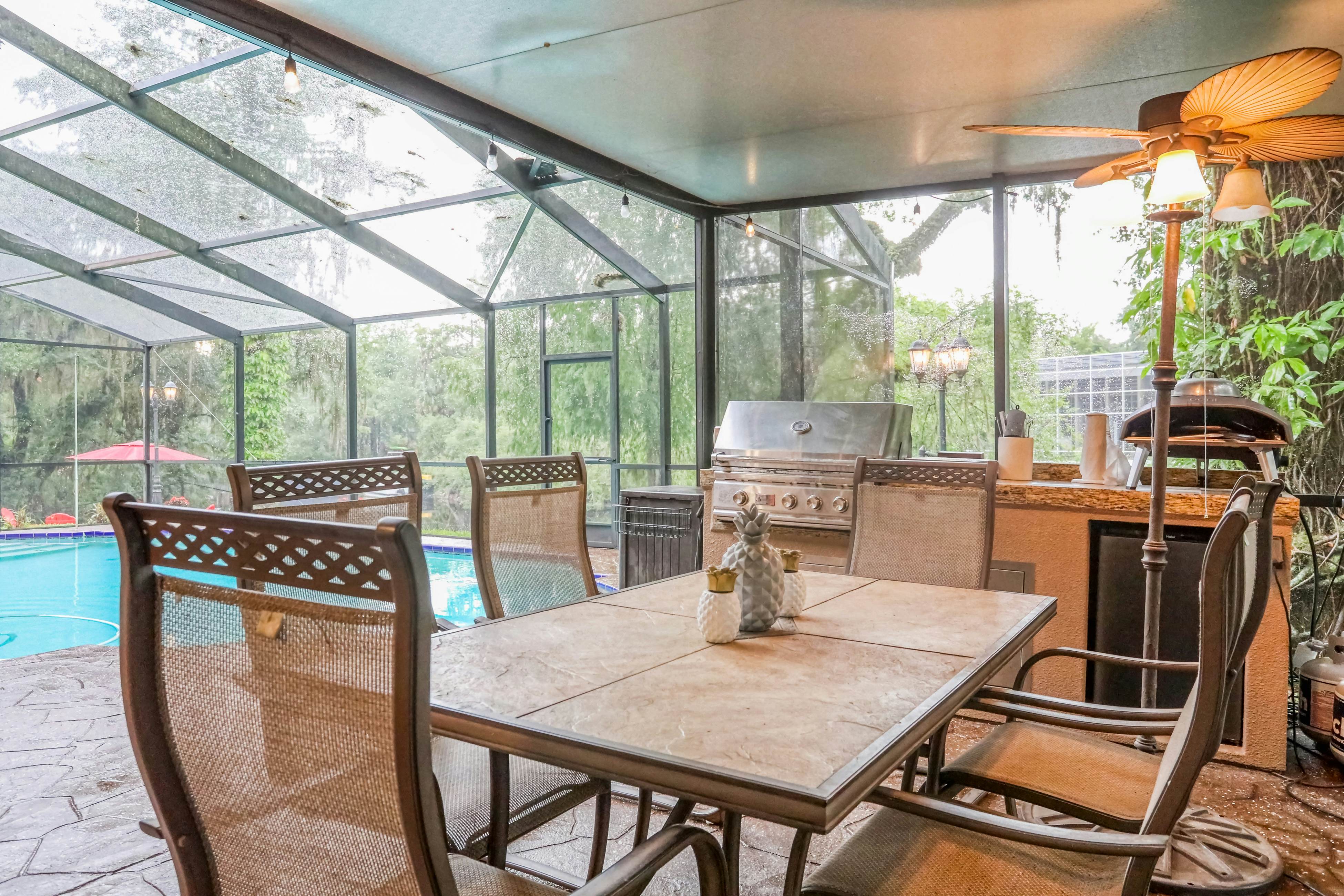 Riverfront retreat with pool/spa, outdoor kitchen, firepit, dock, sauna & games