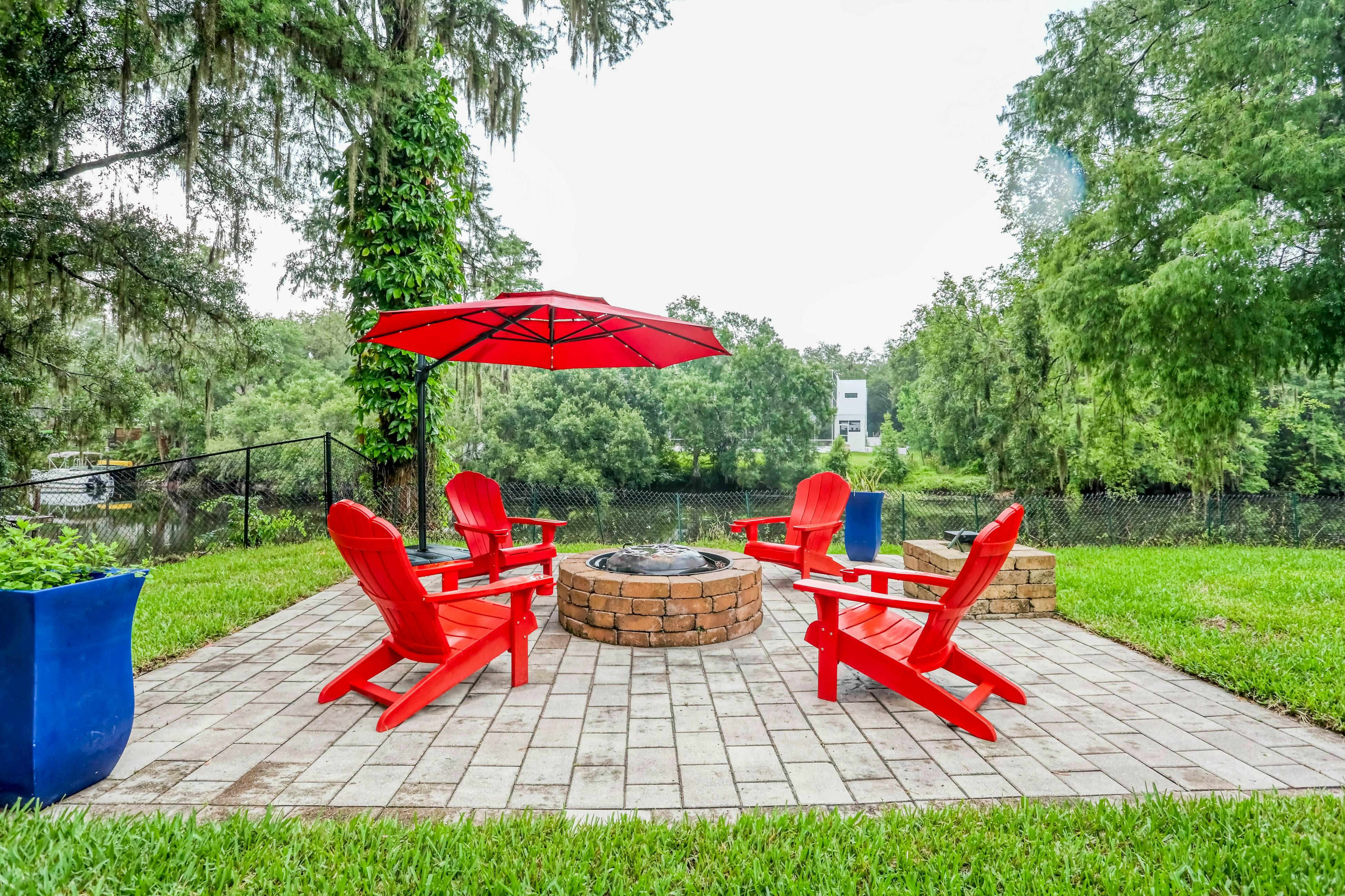 Riverfront retreat with pool/spa, outdoor kitchen, firepit, dock, sauna & games