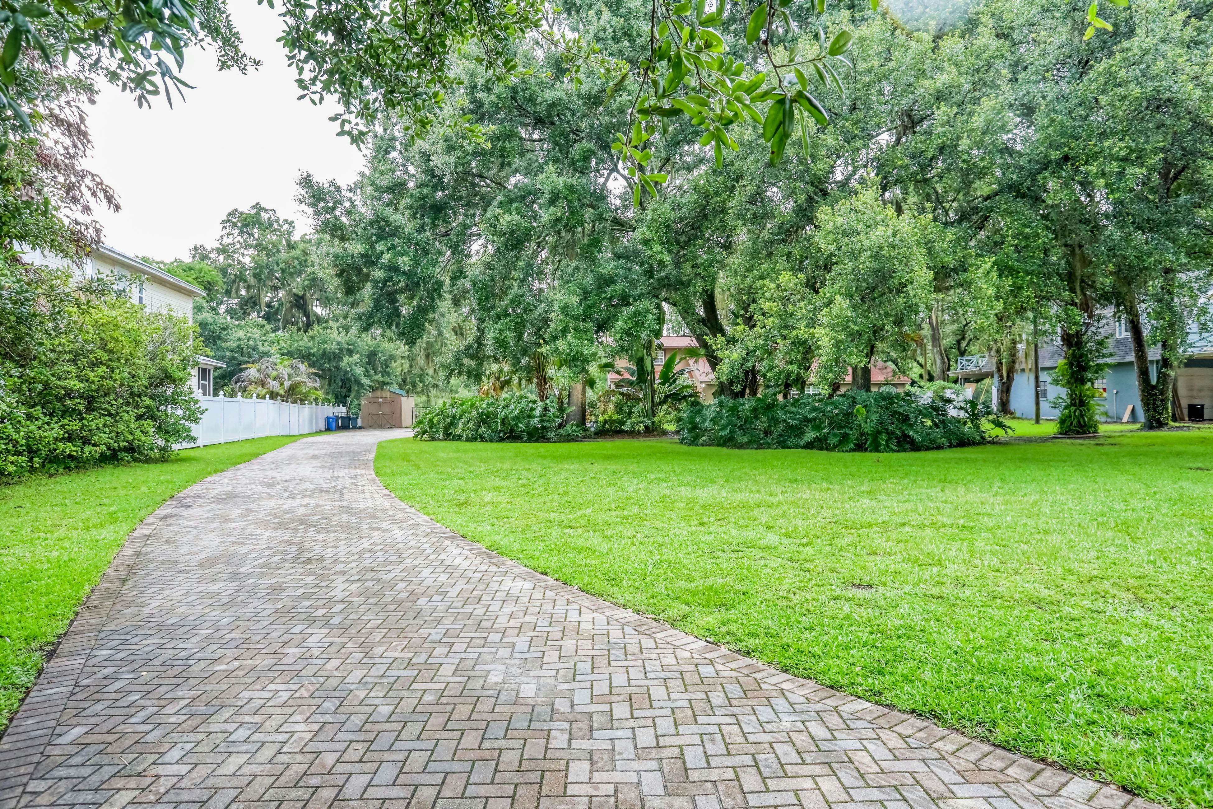 Riverfront retreat with pool/spa, outdoor kitchen, firepit, dock, sauna & games