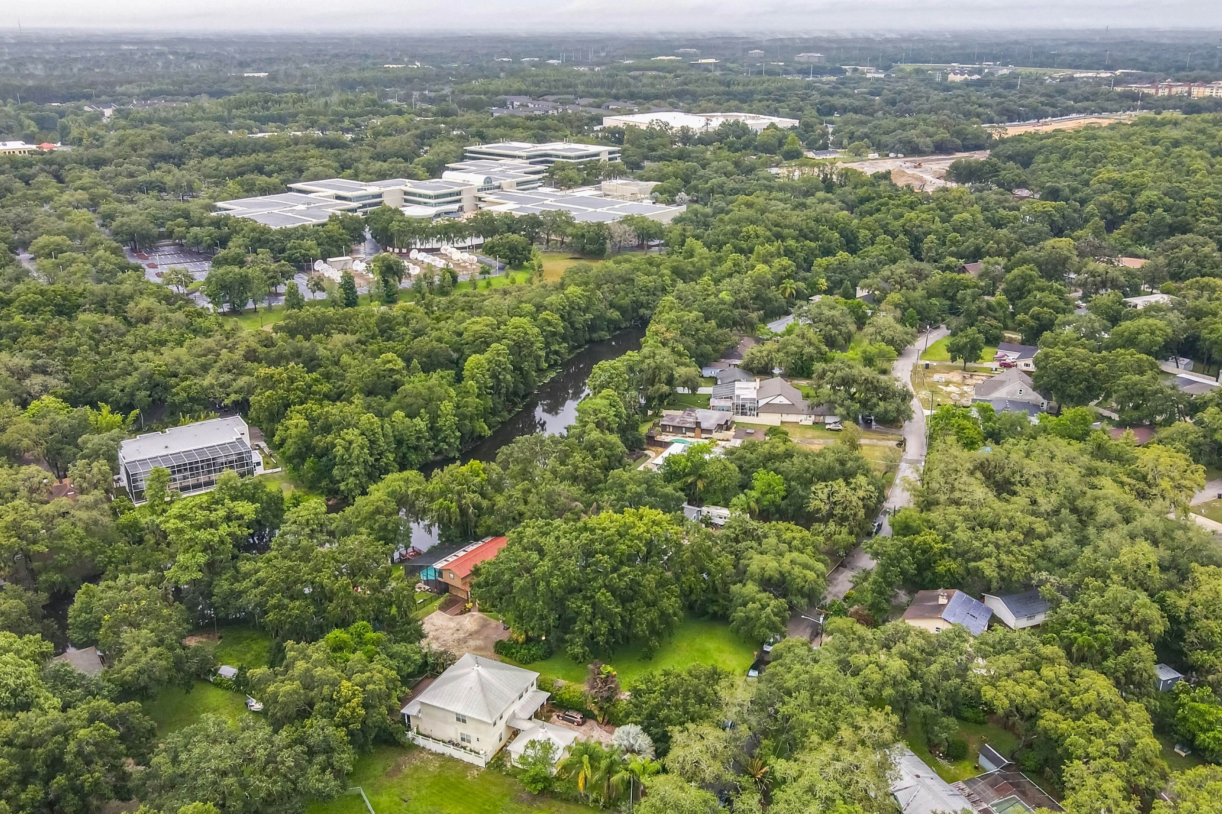 Riverfront retreat with pool/spa, outdoor kitchen, firepit, dock, sauna & games