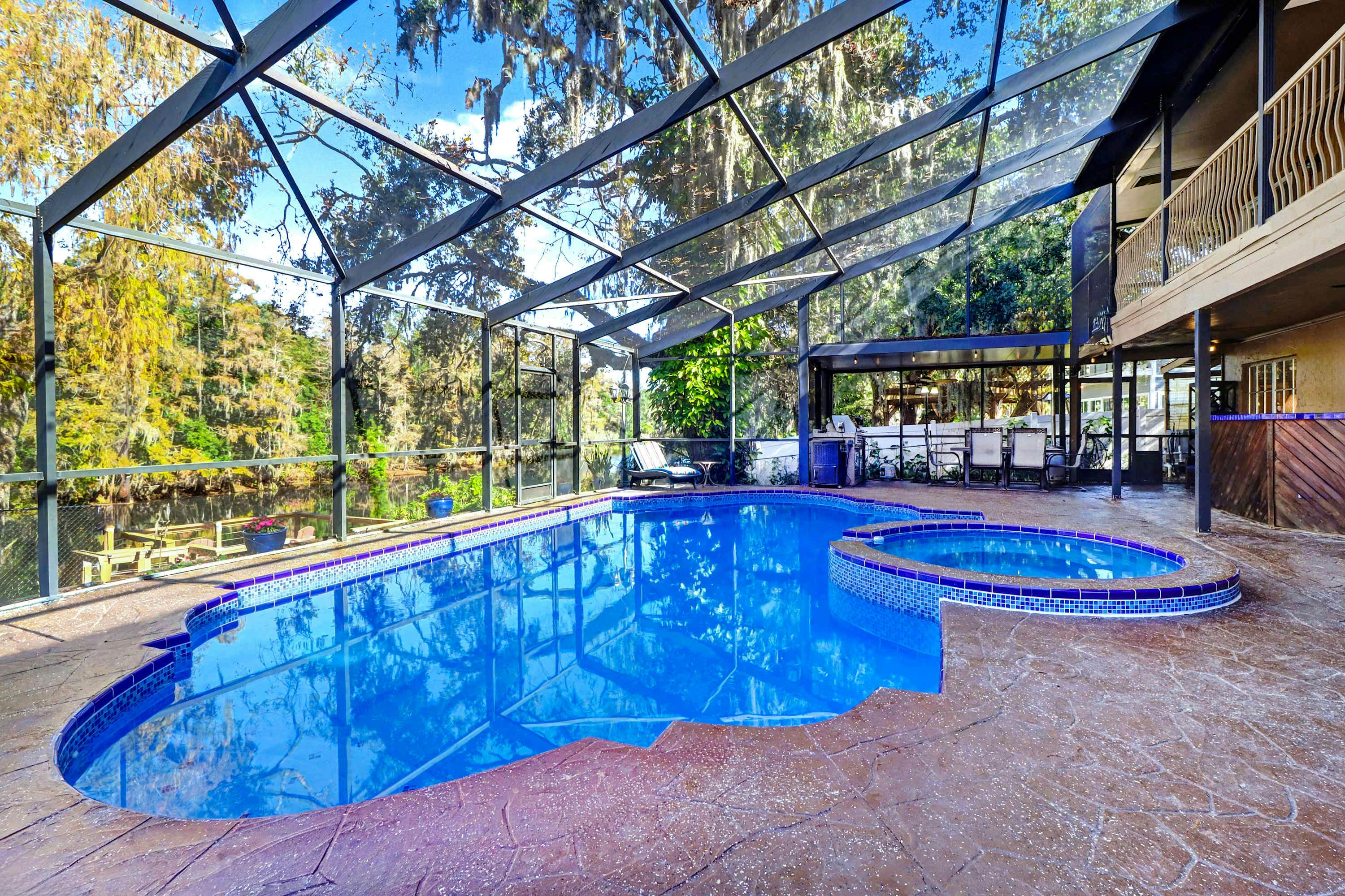 Riverfront retreat with pool spa outdoor kitchen firepit dock sauna and games