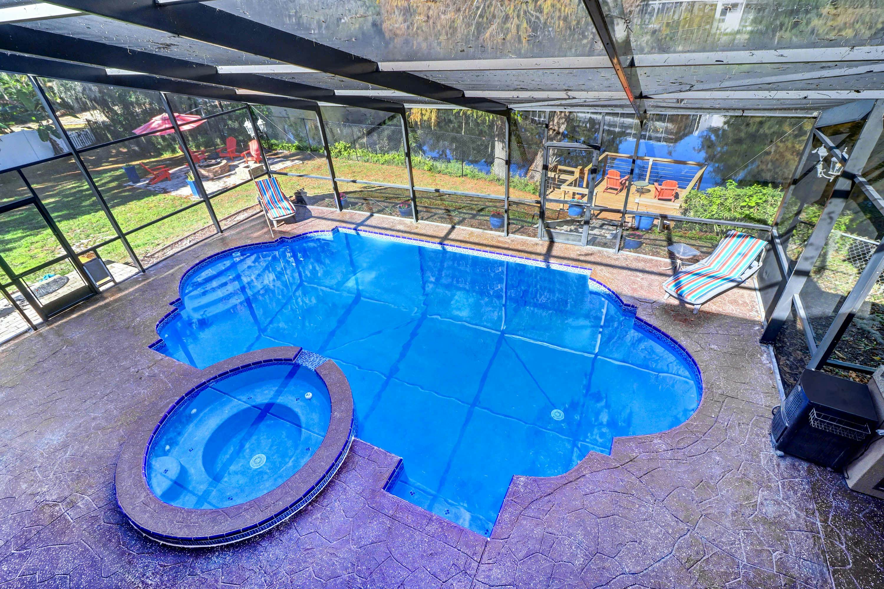 Riverfront retreat with pool spa outdoor kitchen firepit dock sauna and games