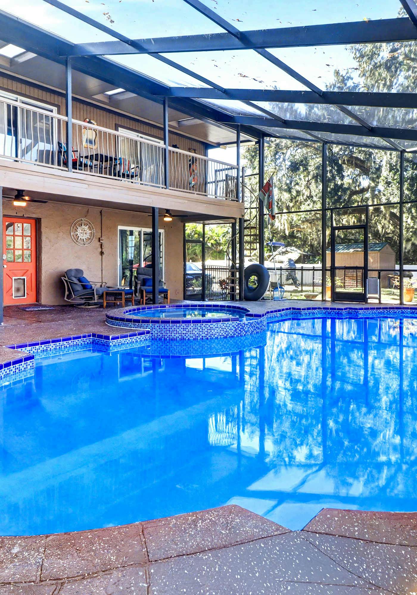 Riverfront retreat with pool spa outdoor kitchen firepit dock sauna and games