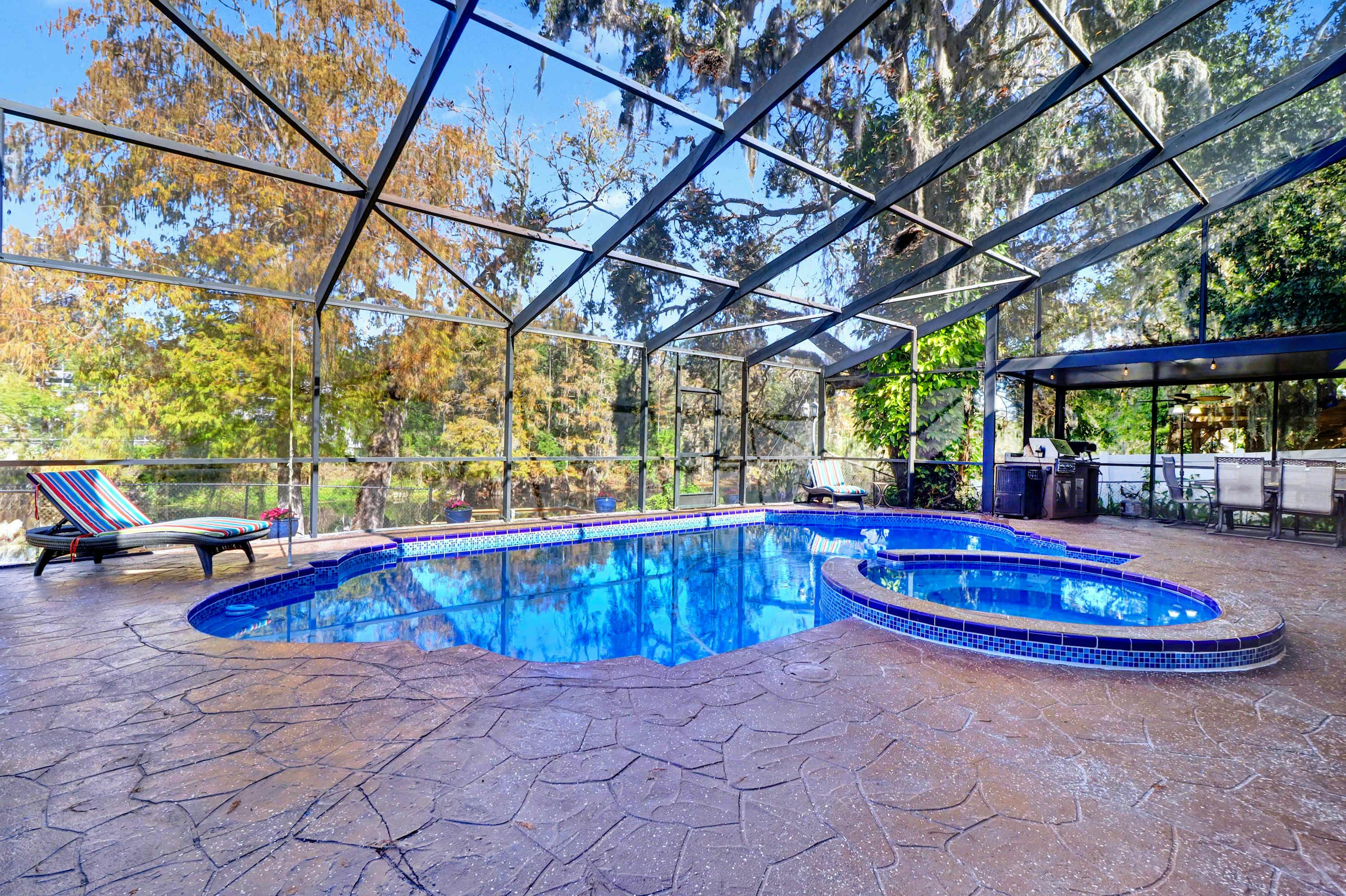 Riverfront retreat with pool spa outdoor kitchen firepit dock sauna and games