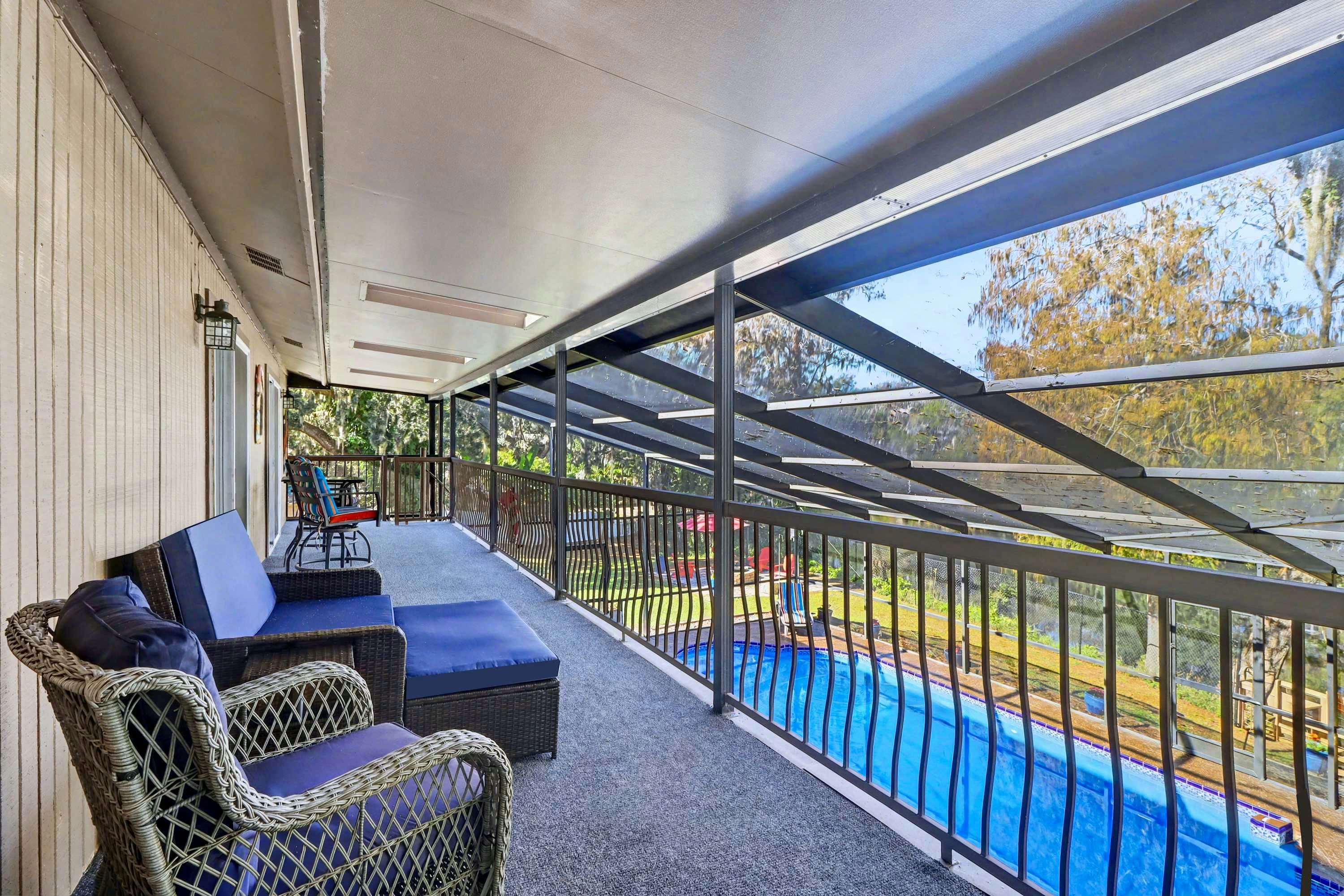 Riverfront retreat with pool spa outdoor kitchen firepit dock sauna and games