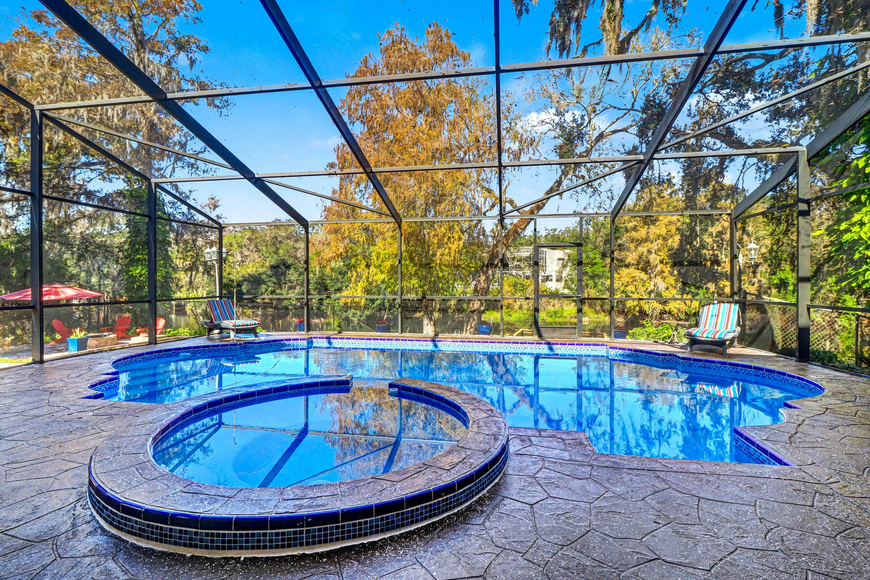 Riverfront retreat with pool spa outdoor kitchen firepit dock sauna and games