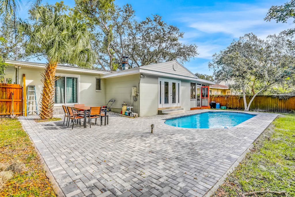 Single level home with pool fenced yard and screened porch a neighborhood park