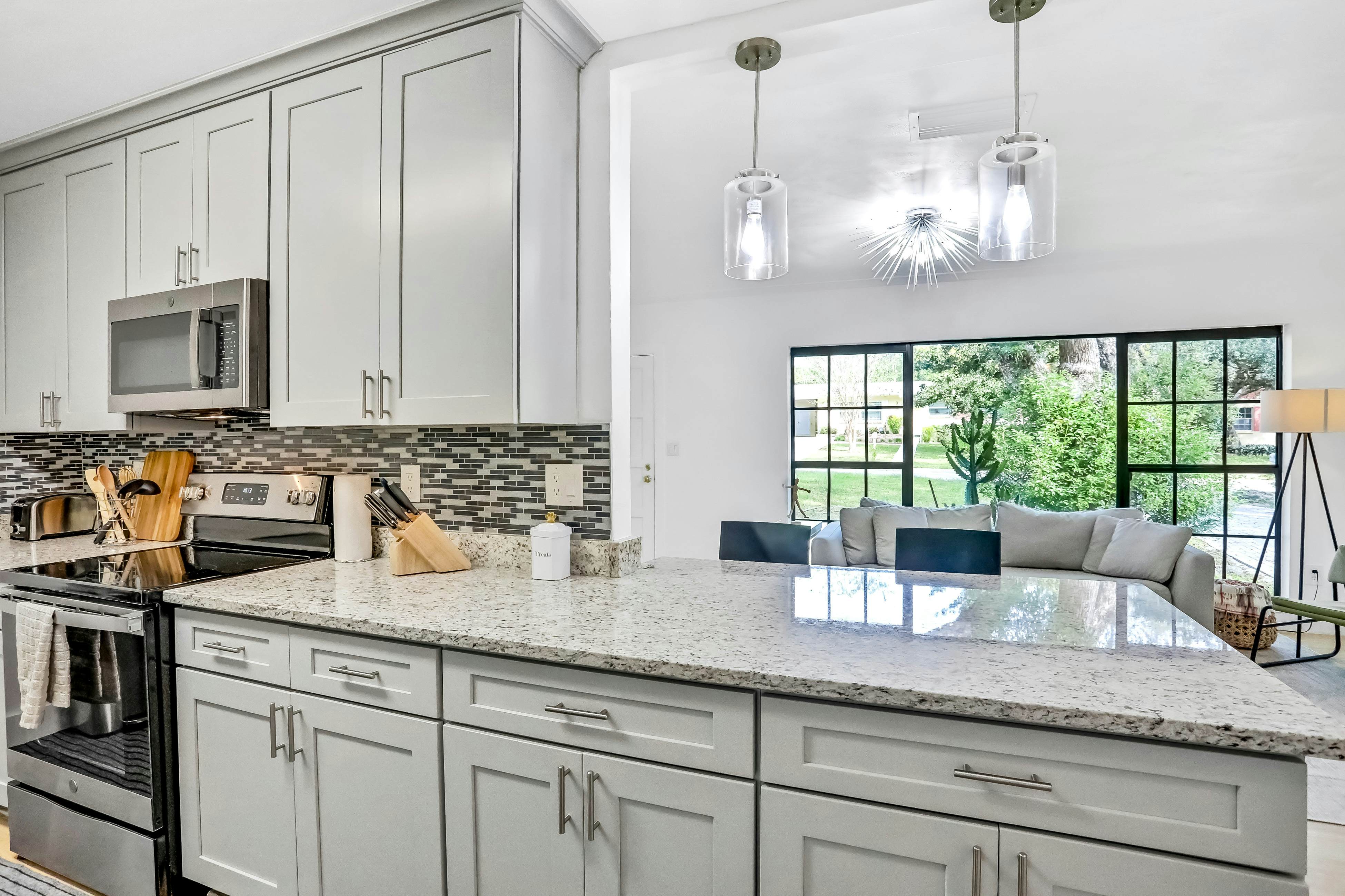 Single-level home with pool, fenced yard, & screened porch + a neighborhood park