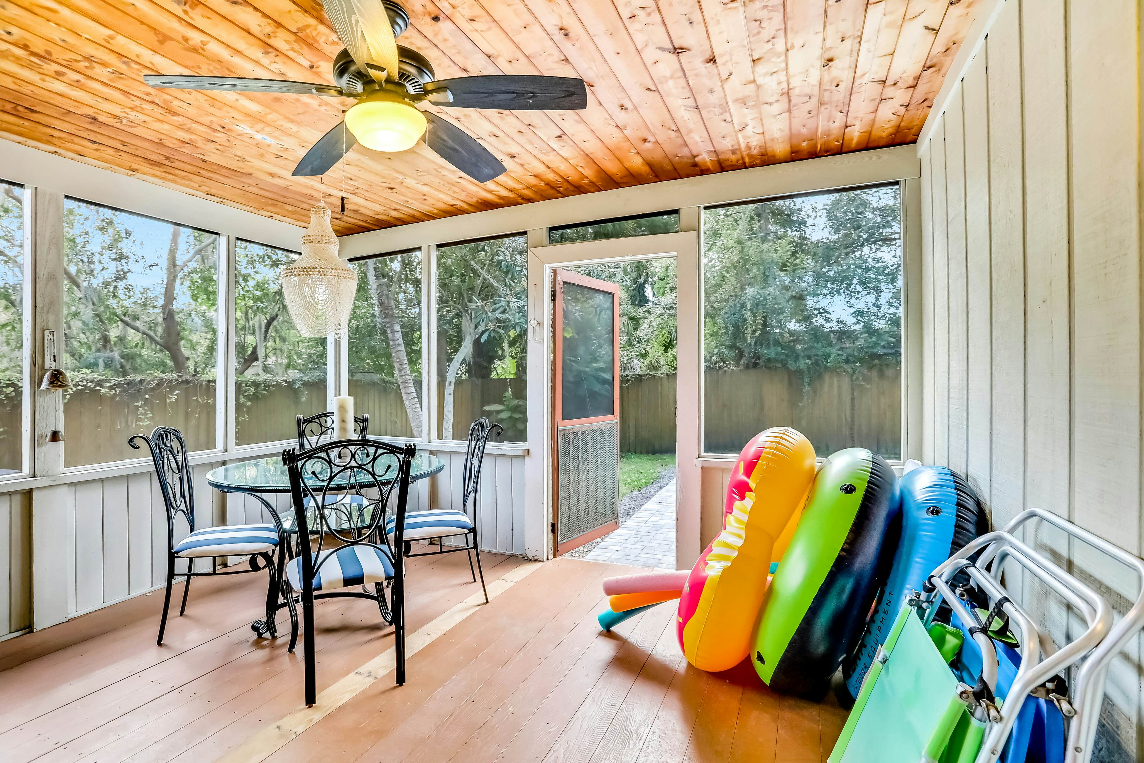 Single-level home with pool, fenced yard, & screened porch + a neighborhood park