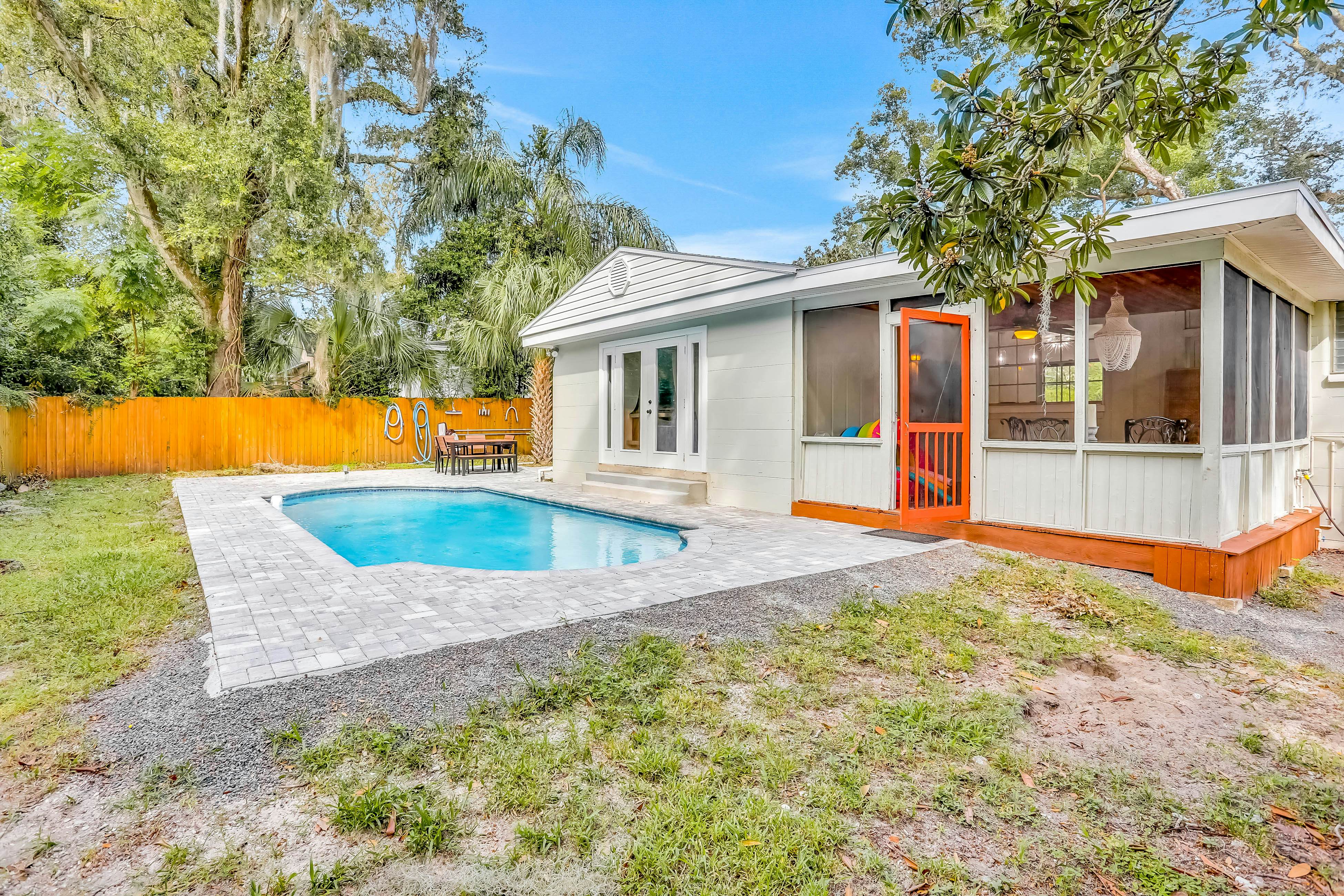 Single-level home with pool, fenced yard, & screened porch + a neighborhood park