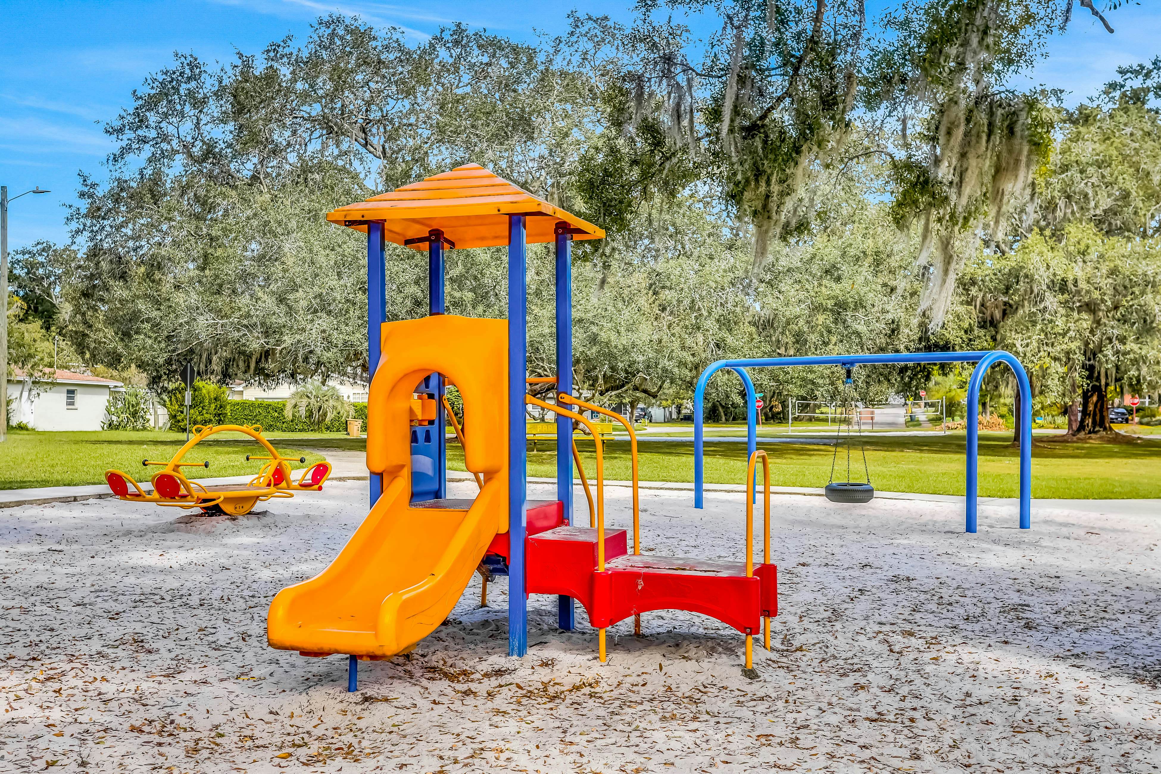 Single-level home with pool, fenced yard, & screened porch + a neighborhood park