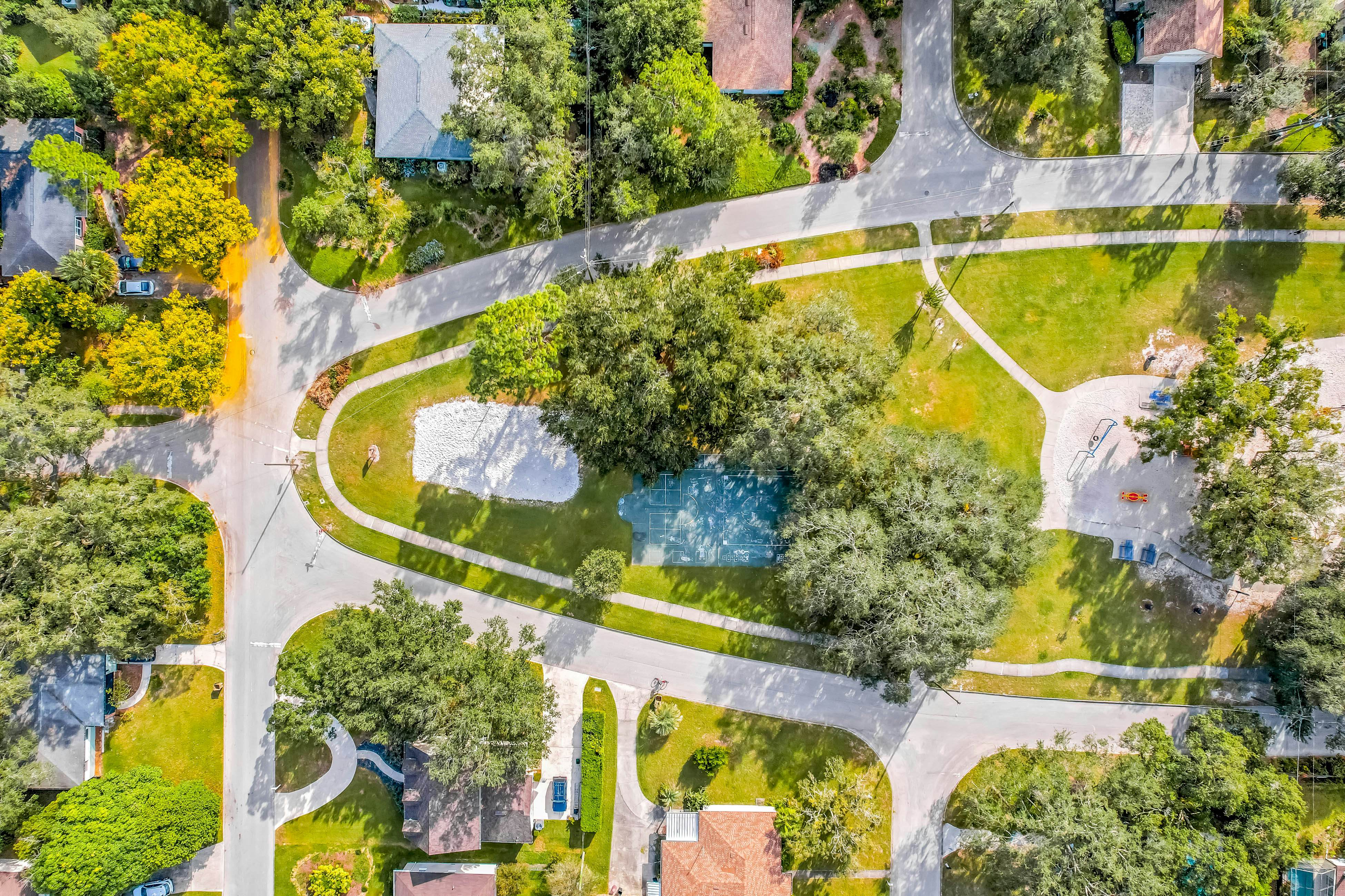 Single-level home with pool, fenced yard, & screened porch + a neighborhood park