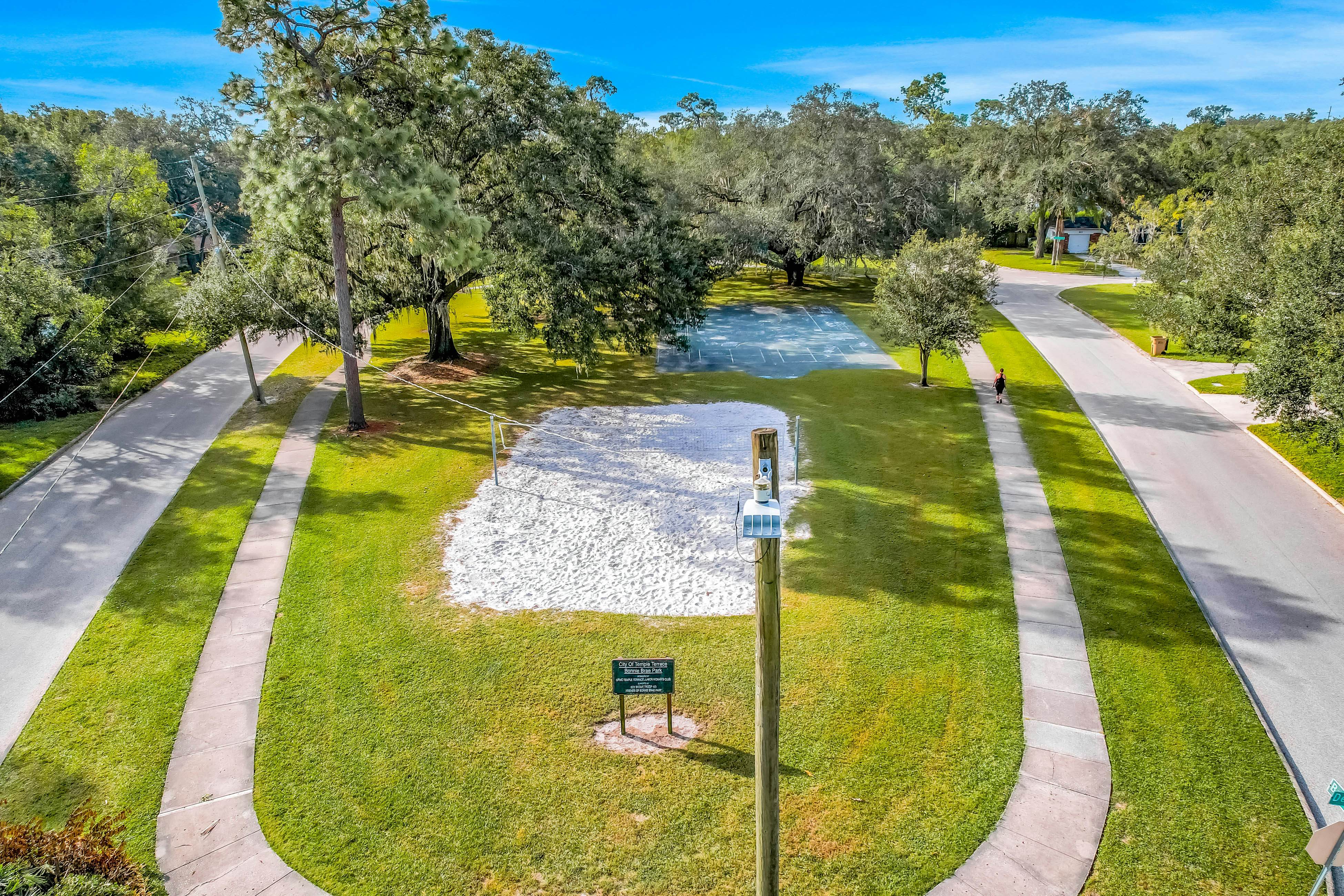 Single-level home with pool, fenced yard, & screened porch + a neighborhood park