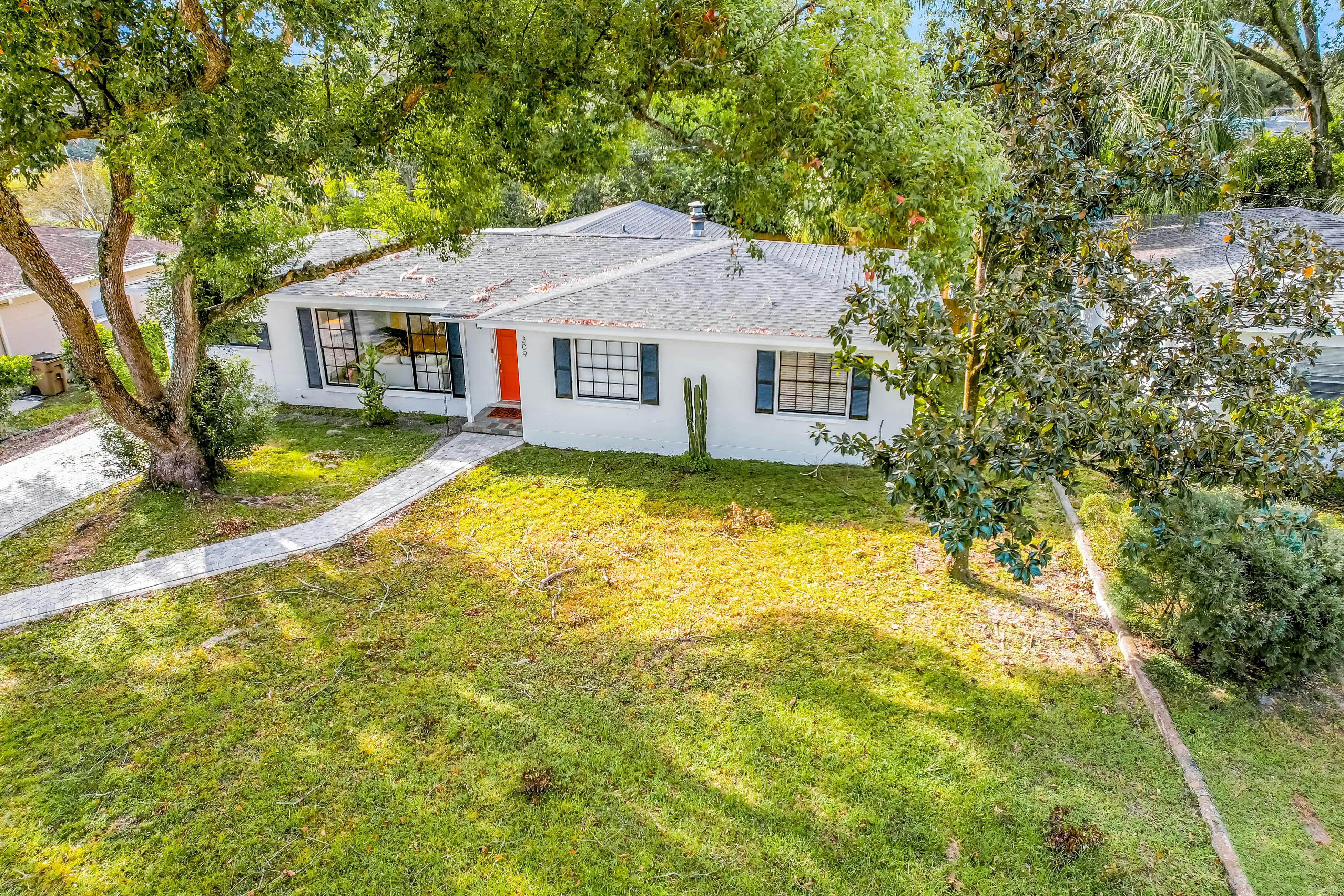 Single-level home with pool, fenced yard, & screened porch + a neighborhood park