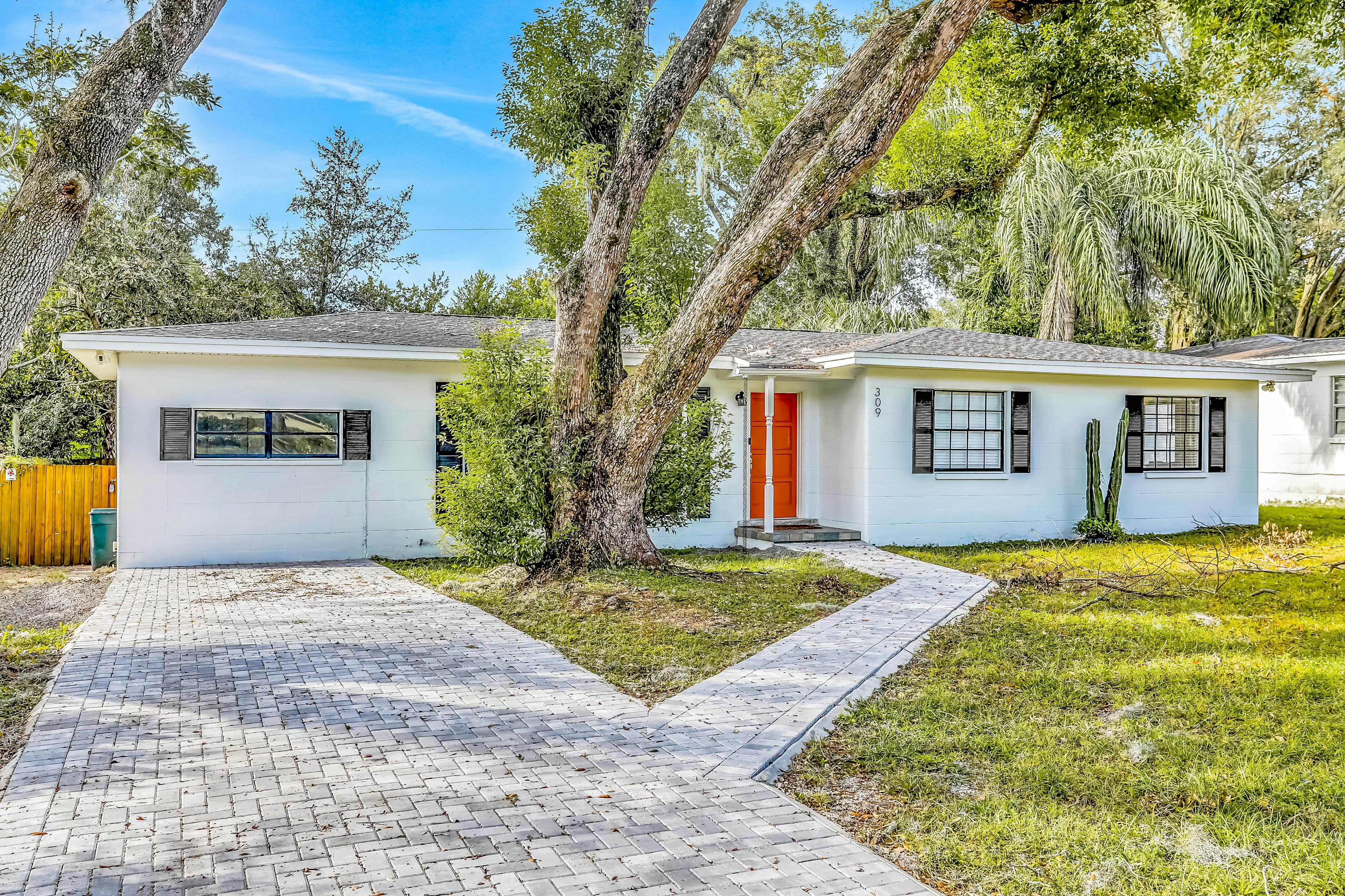 Single-level home with pool, fenced yard, & screened porch + a neighborhood park