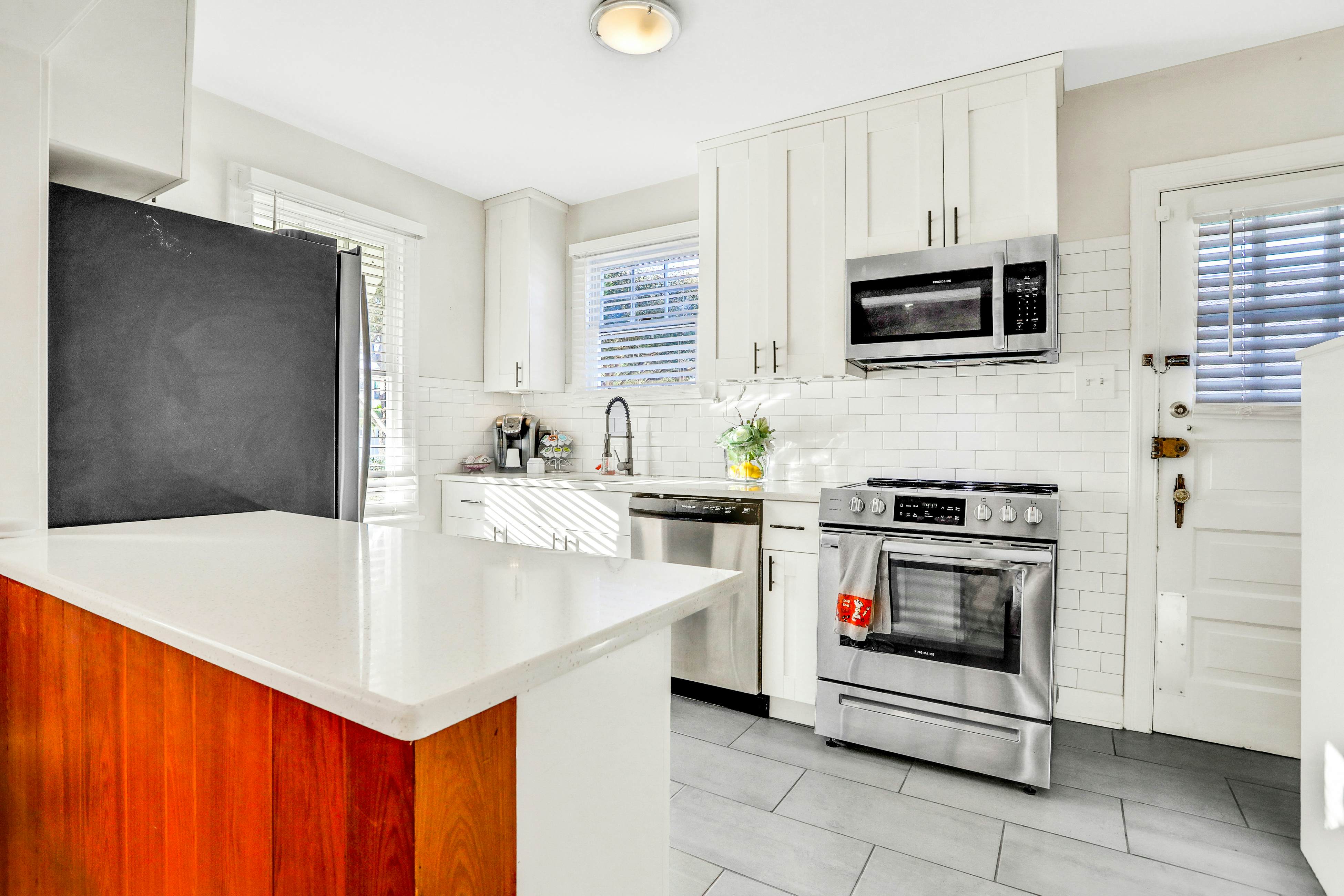 Sunny, dog-friendly central cottage with fenced yard & updated interior