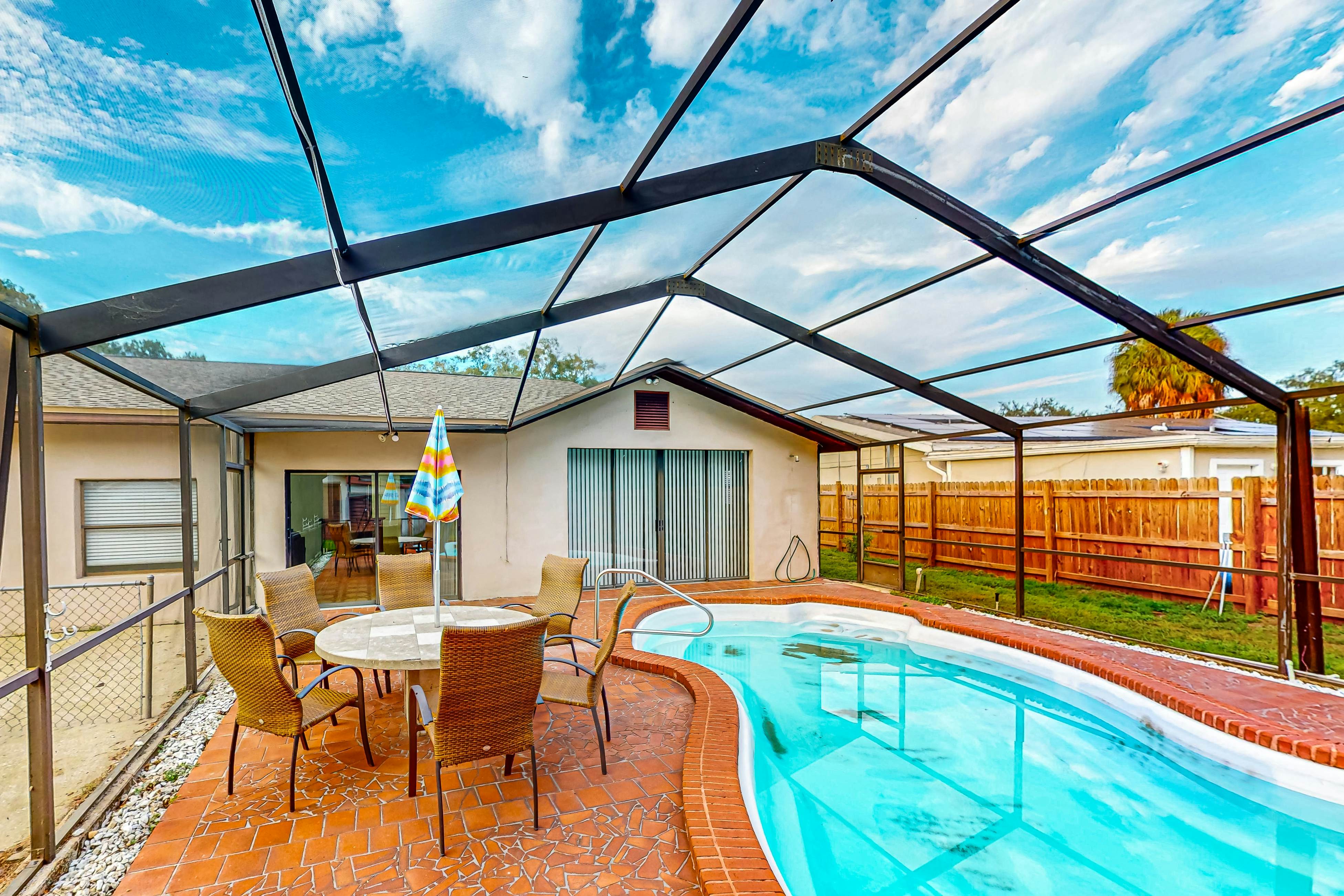 Conveniently located home with private pool, patio, foosball, & private W/D