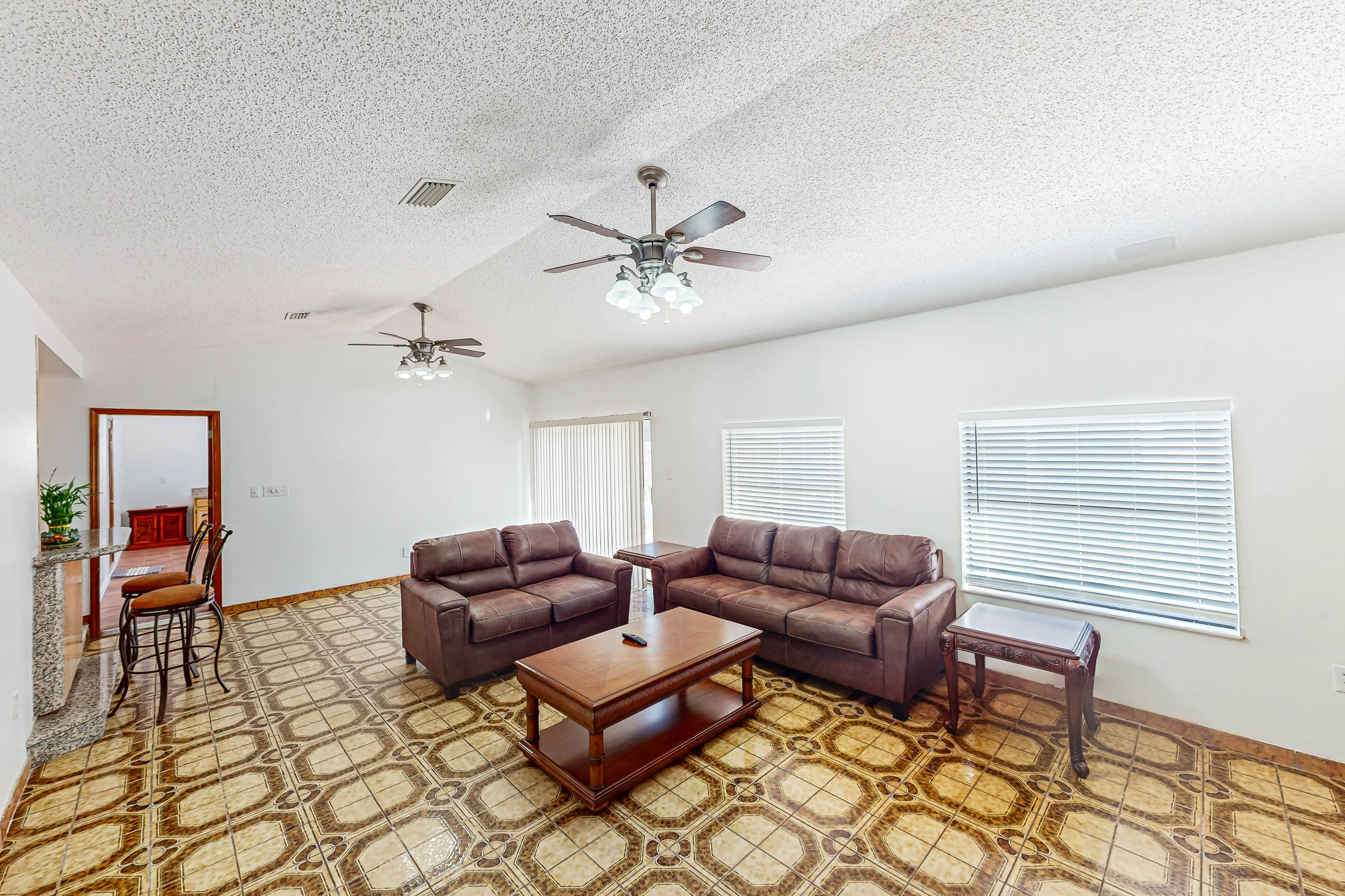 Conveniently located home with private pool, patio, foosball, & private W/D