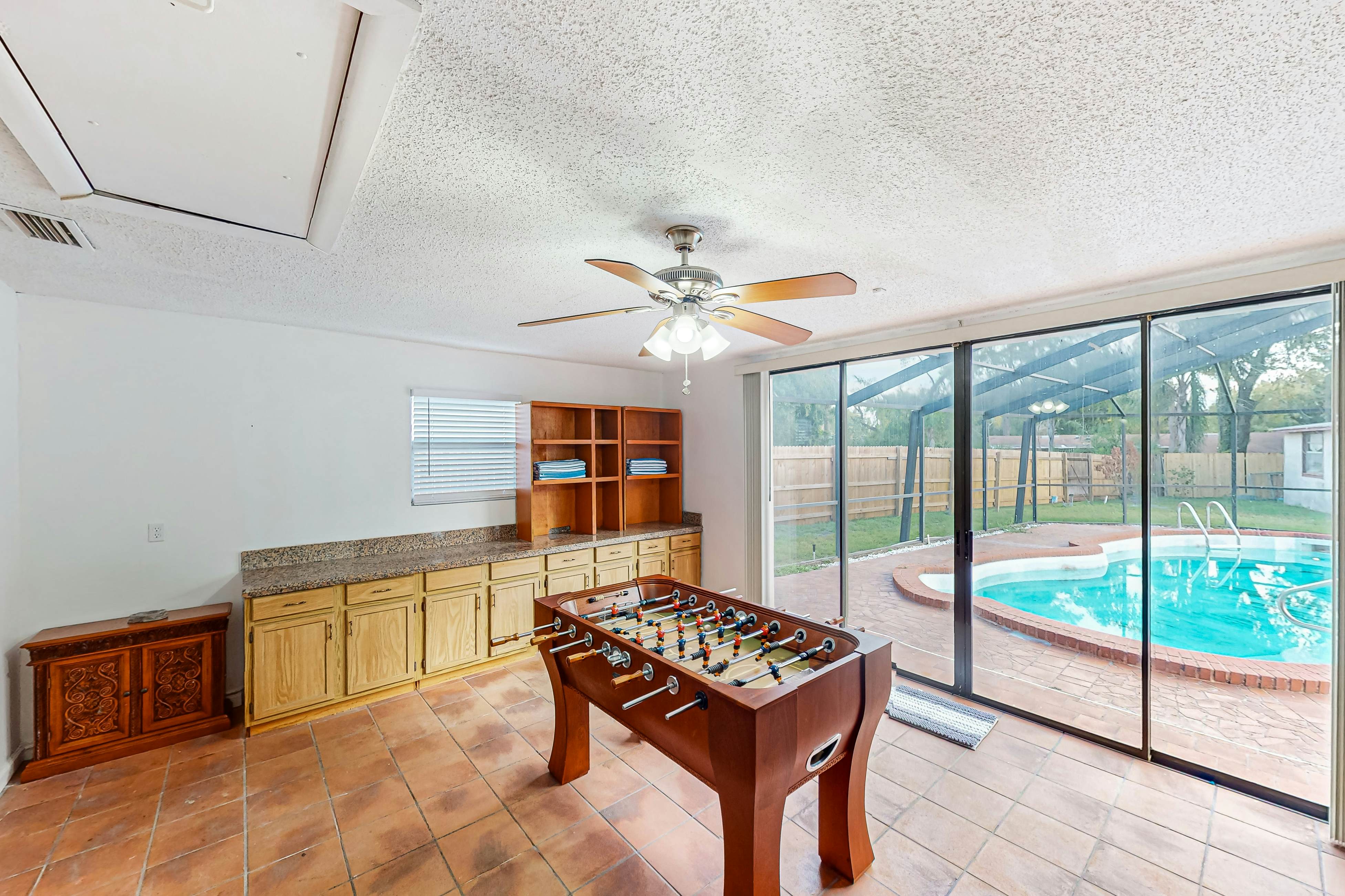 Conveniently located home with private pool, patio, foosball, & private W/D