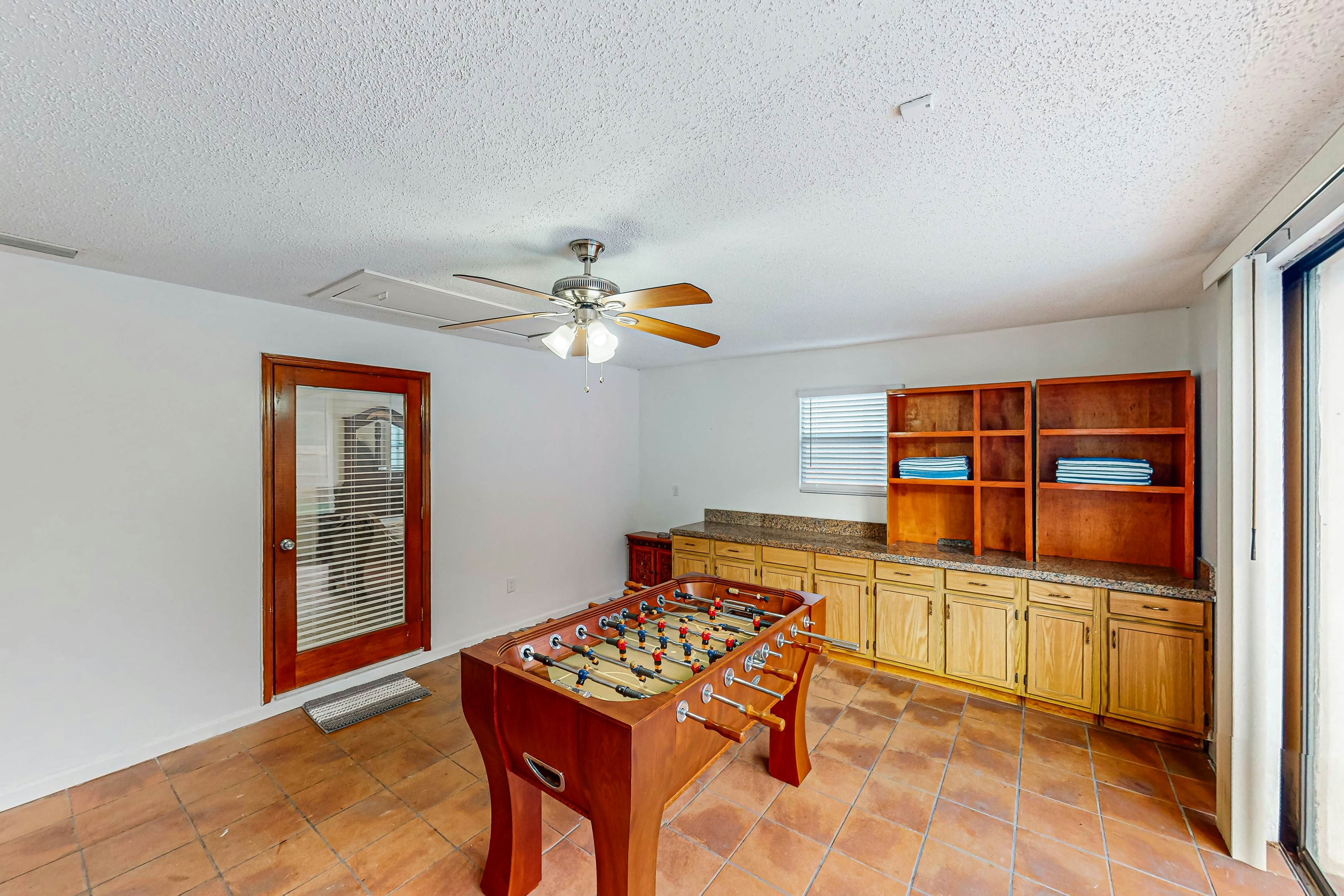 Conveniently located home with private pool, patio, foosball, & private W/D