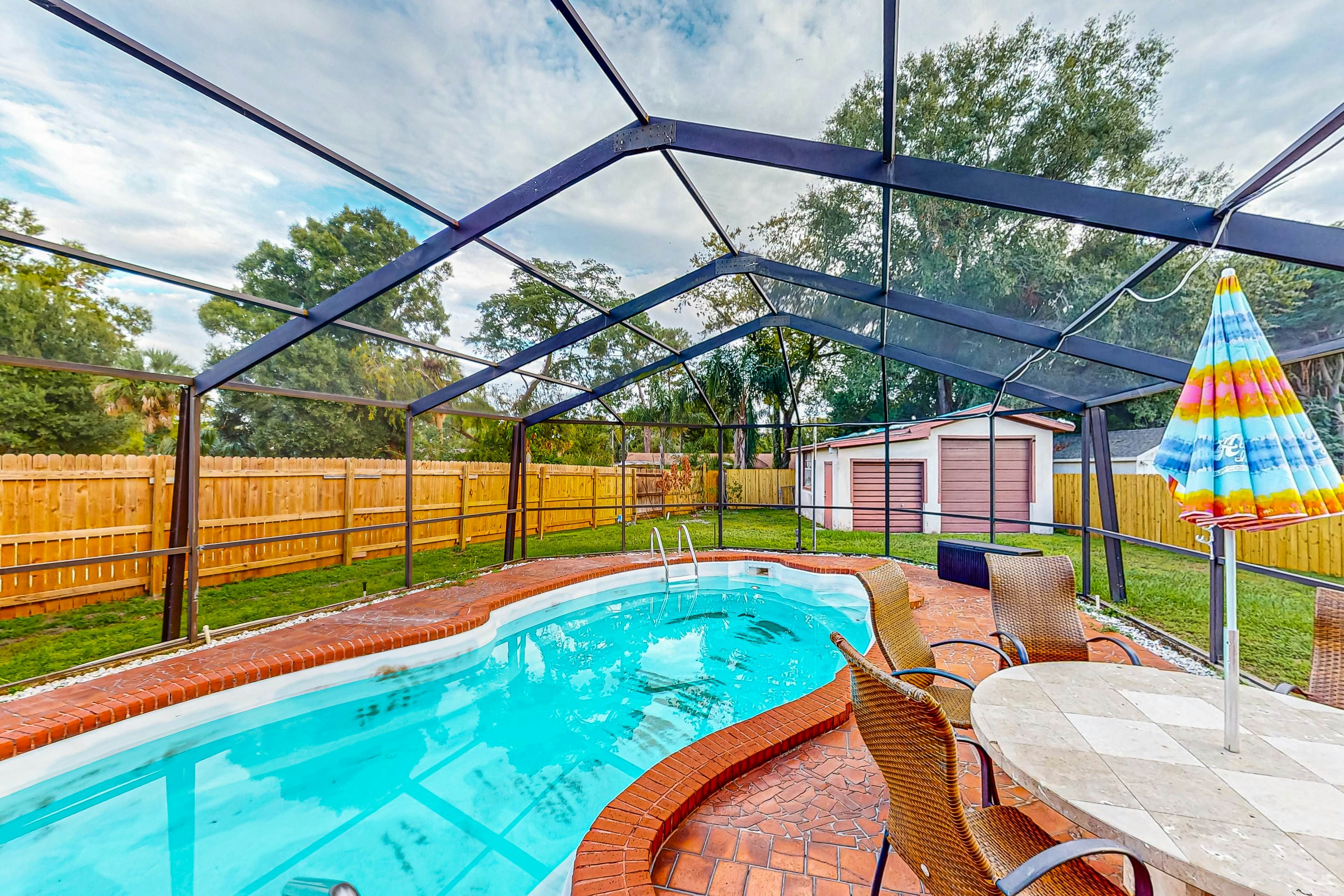 Conveniently located home with private pool, patio, foosball, & private W/D