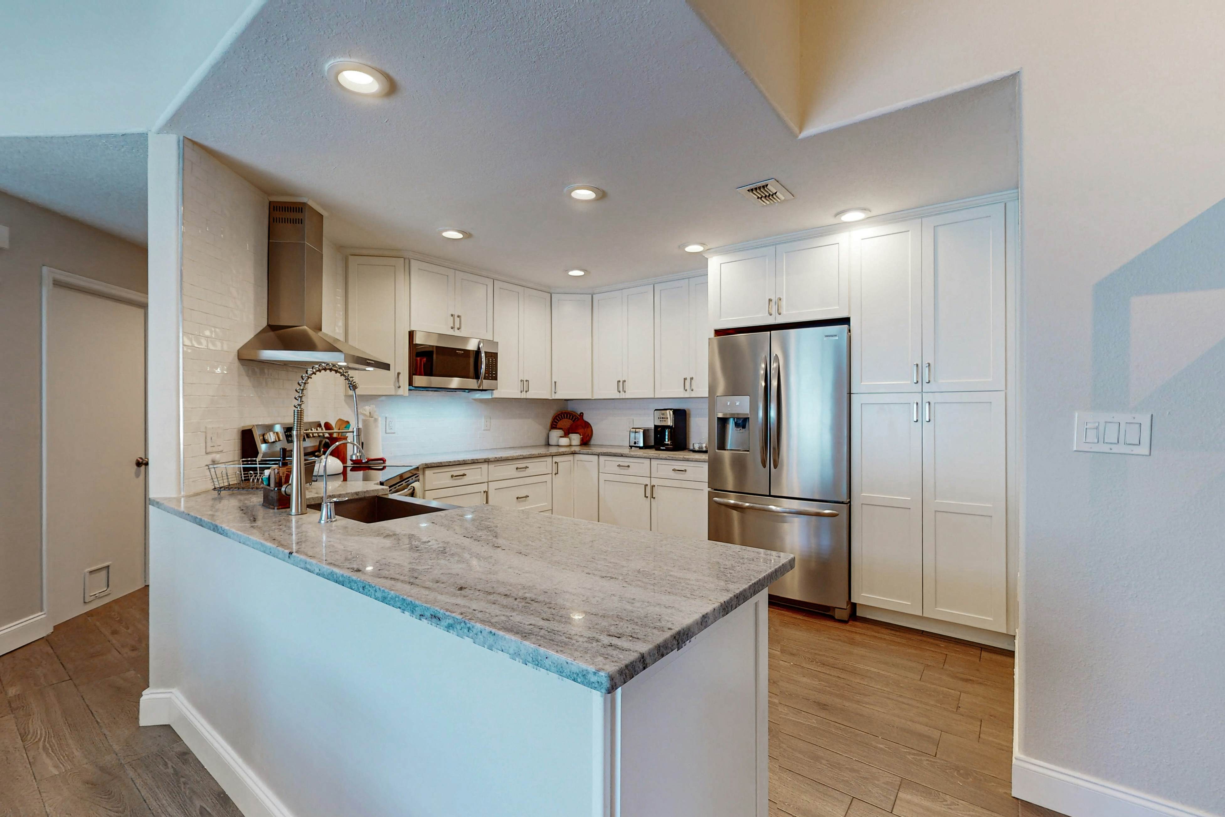 Fully renovated family friendly with covered patio hot tub central location