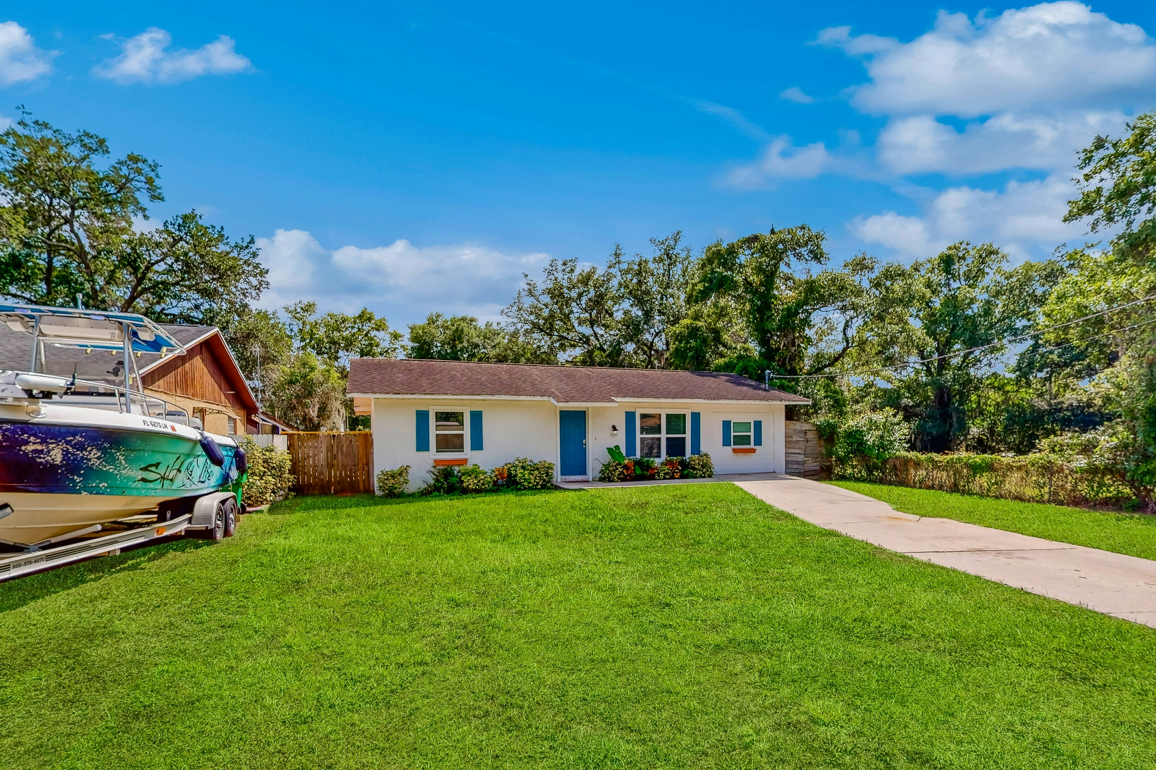 Dog-friendly home with fenced yard, firepit, washer/dryer, & central AC
