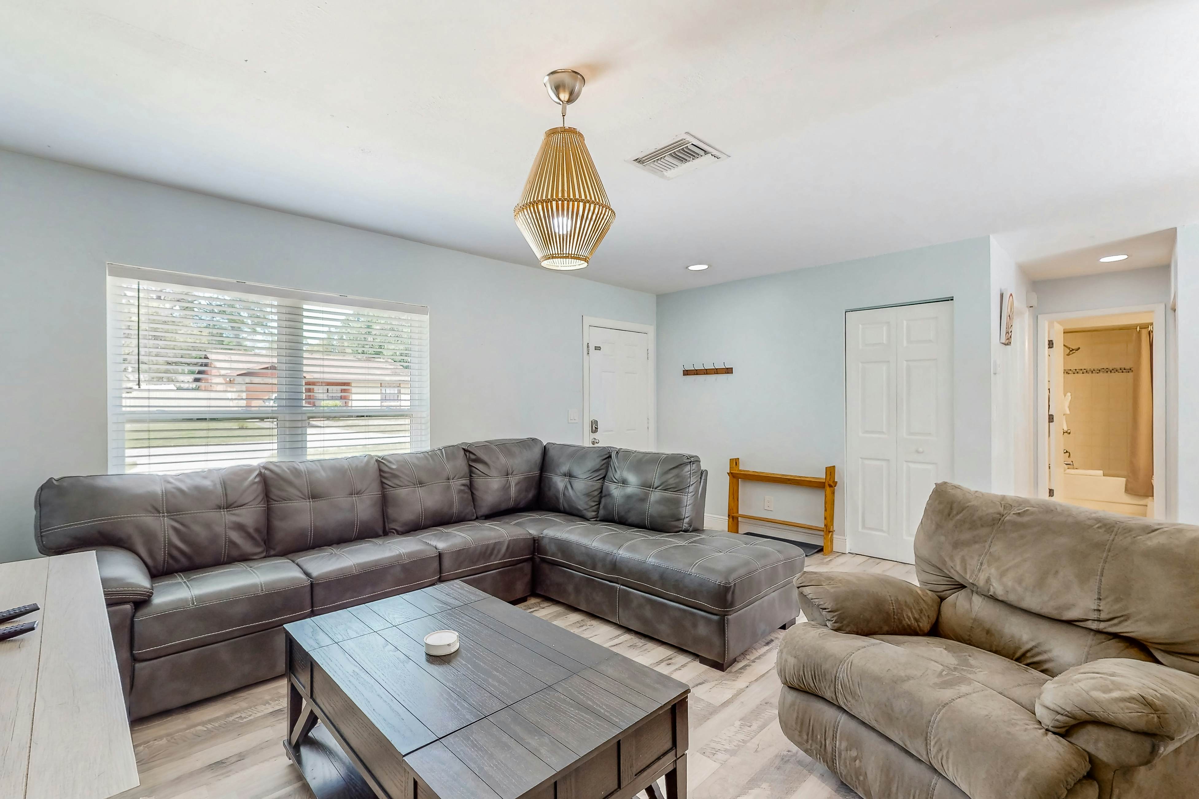 Dog-friendly home with fenced yard, firepit, washer/dryer, & central AC