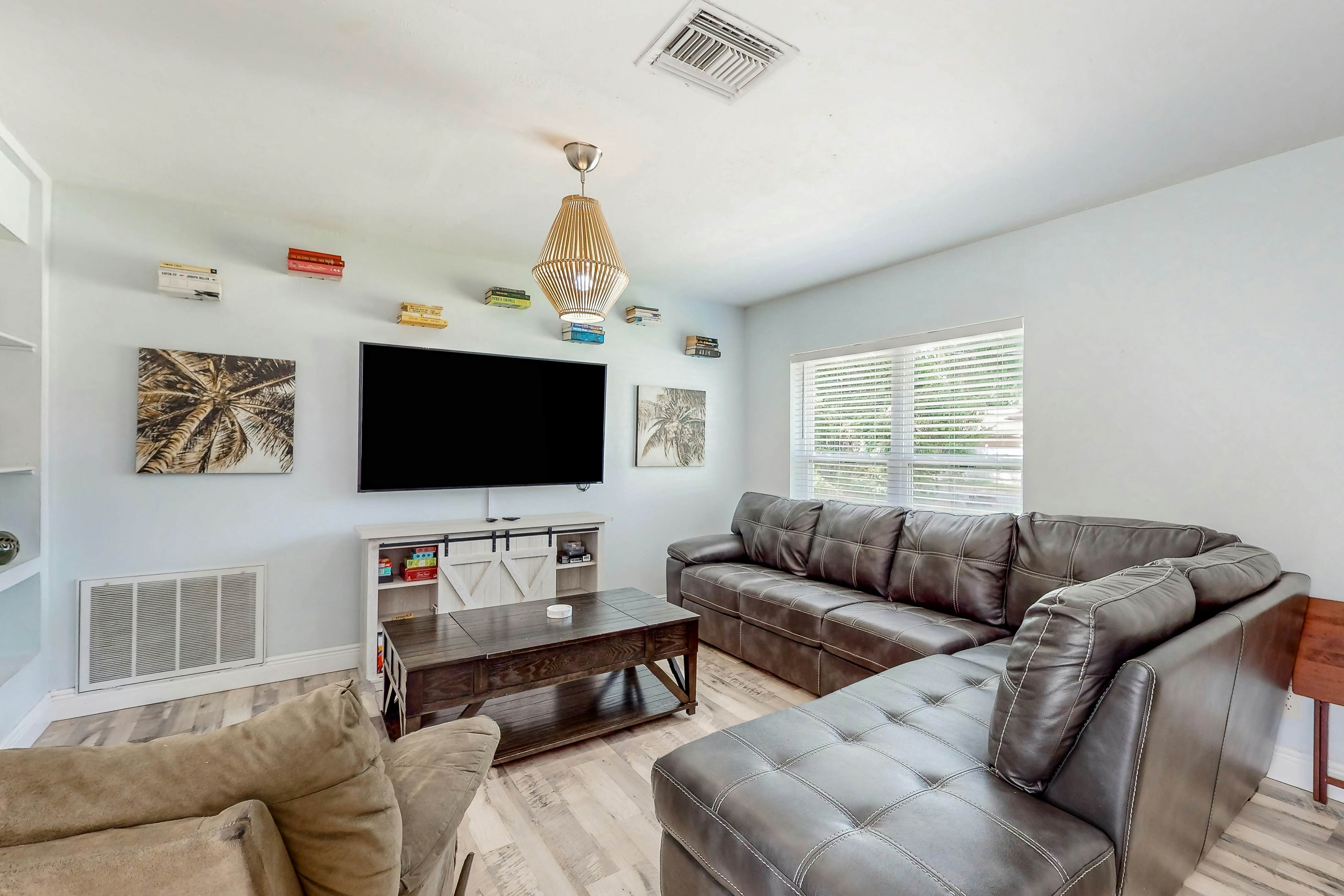 Dog-friendly home with fenced yard, firepit, washer/dryer, & central AC