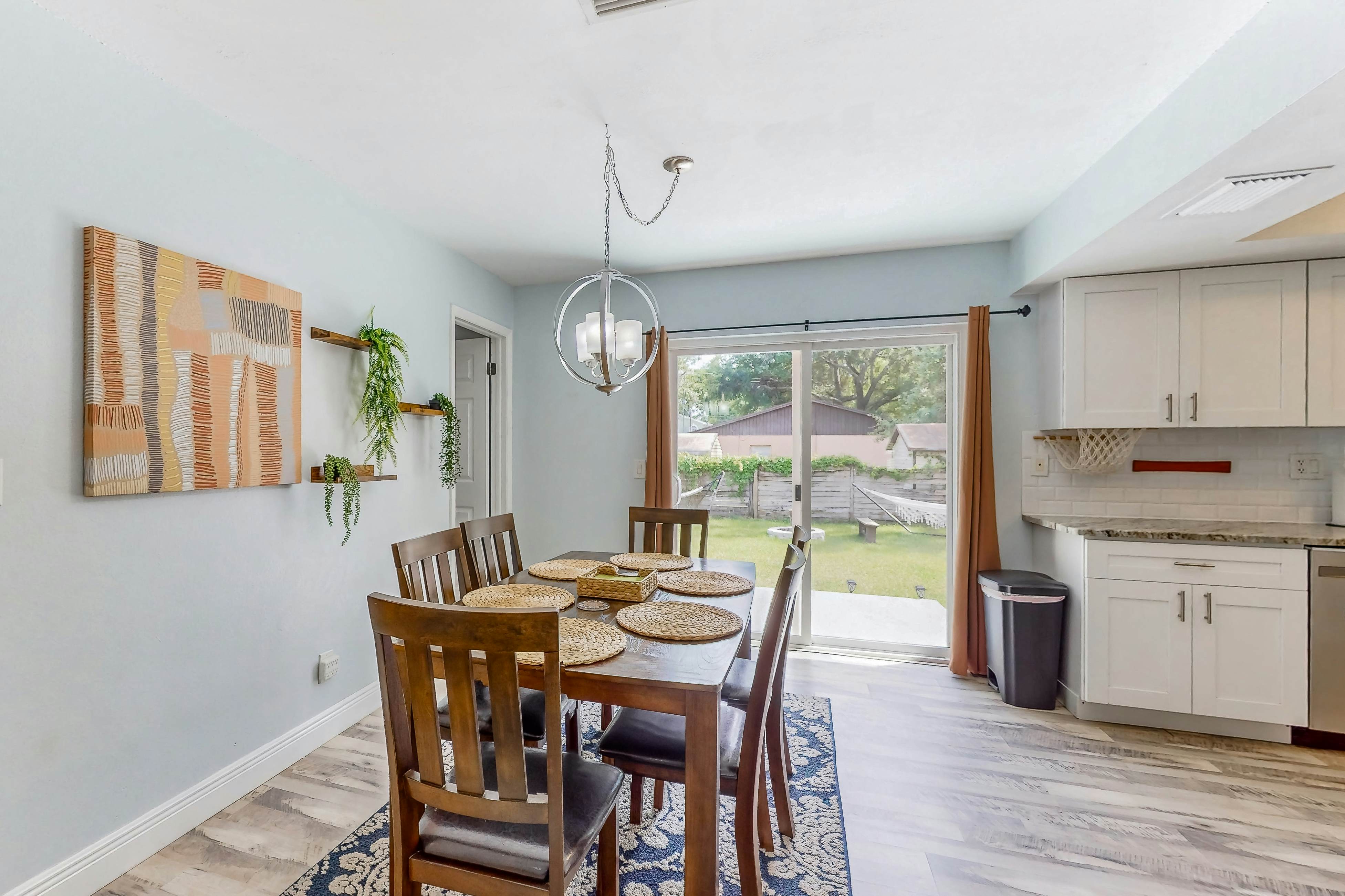 Dog-friendly home with fenced yard, firepit, washer/dryer, & central AC