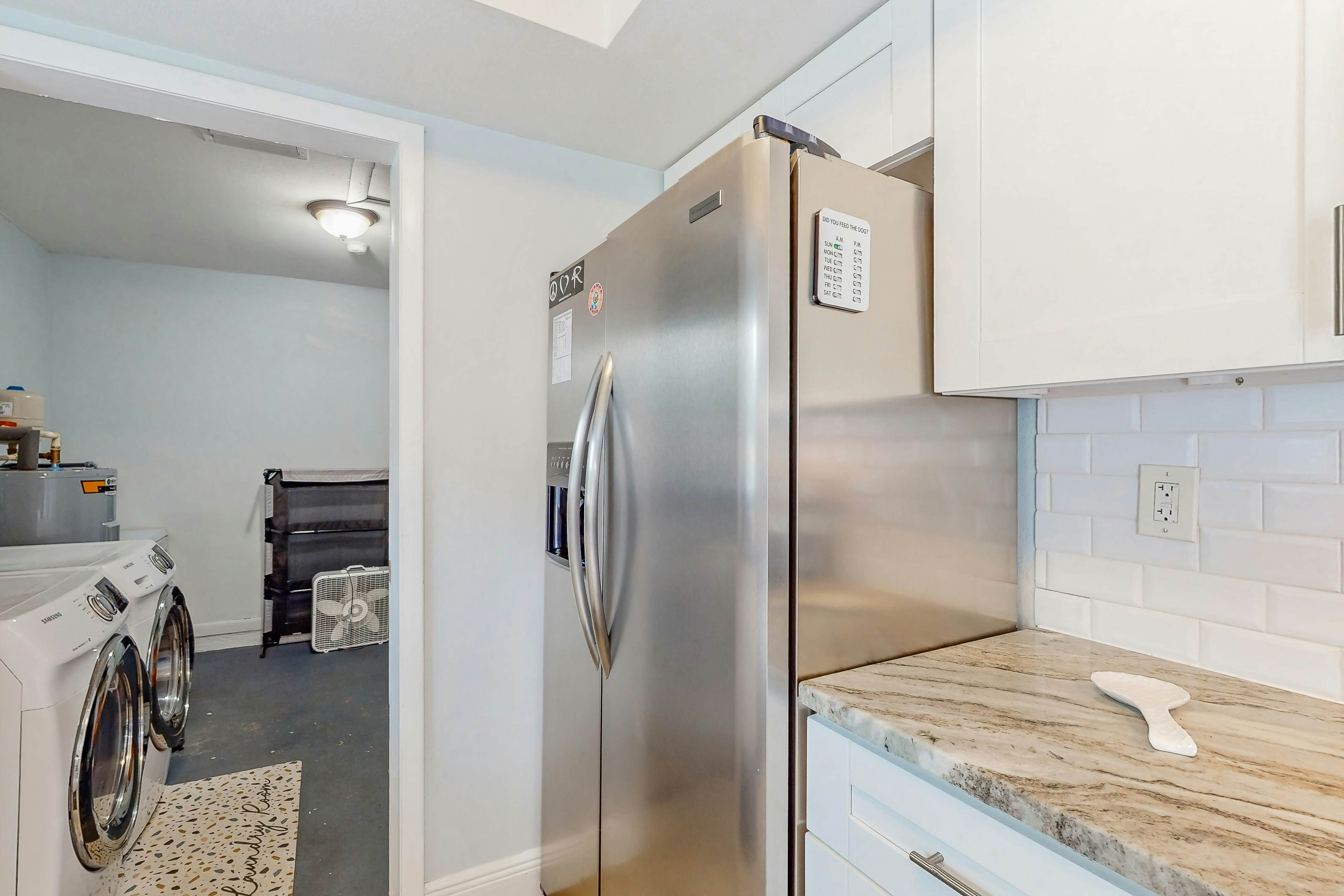 Dog-friendly home with fenced yard, firepit, washer/dryer, & central AC