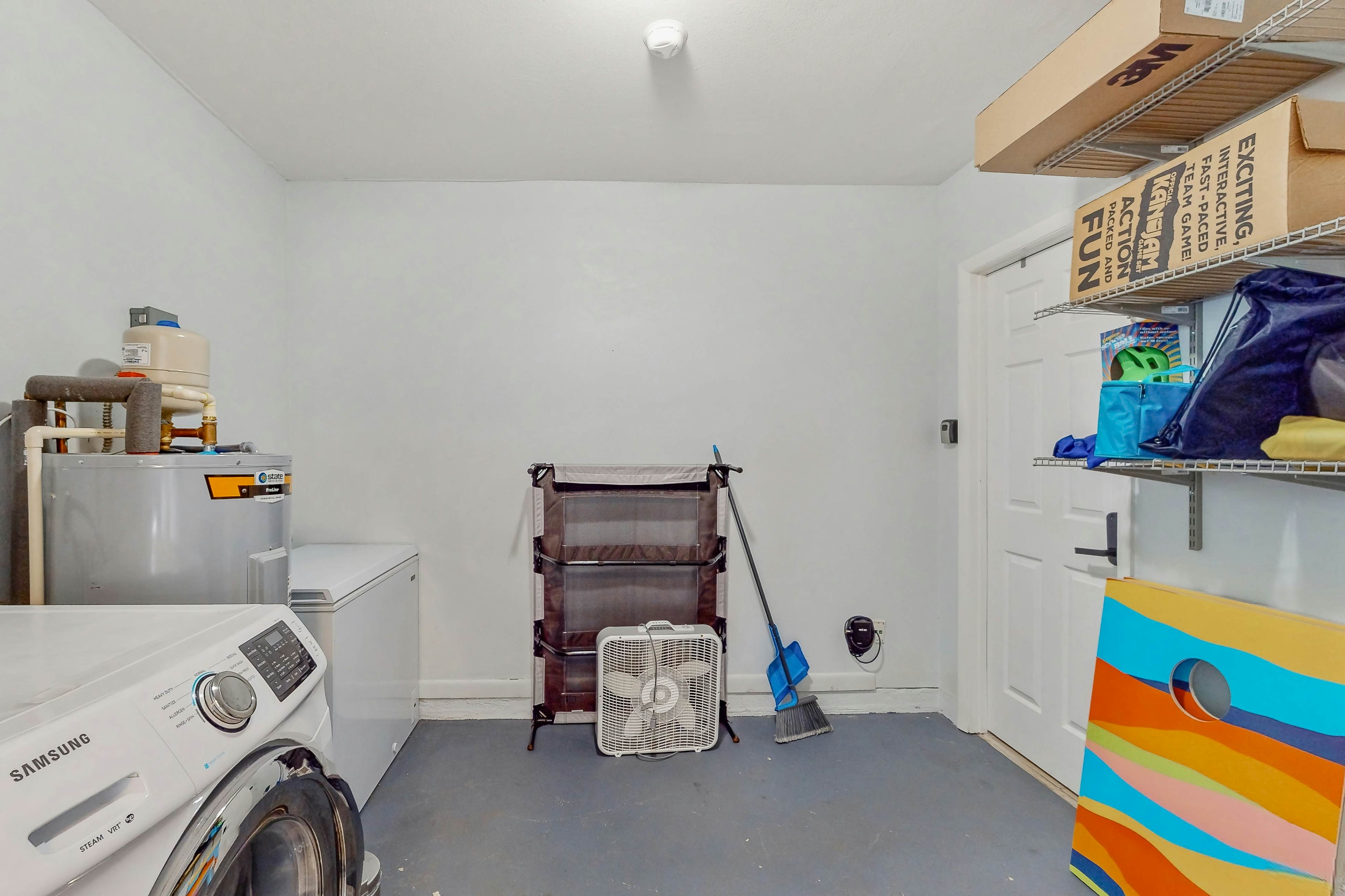 Dog-friendly home with fenced yard, firepit, washer/dryer, & central AC