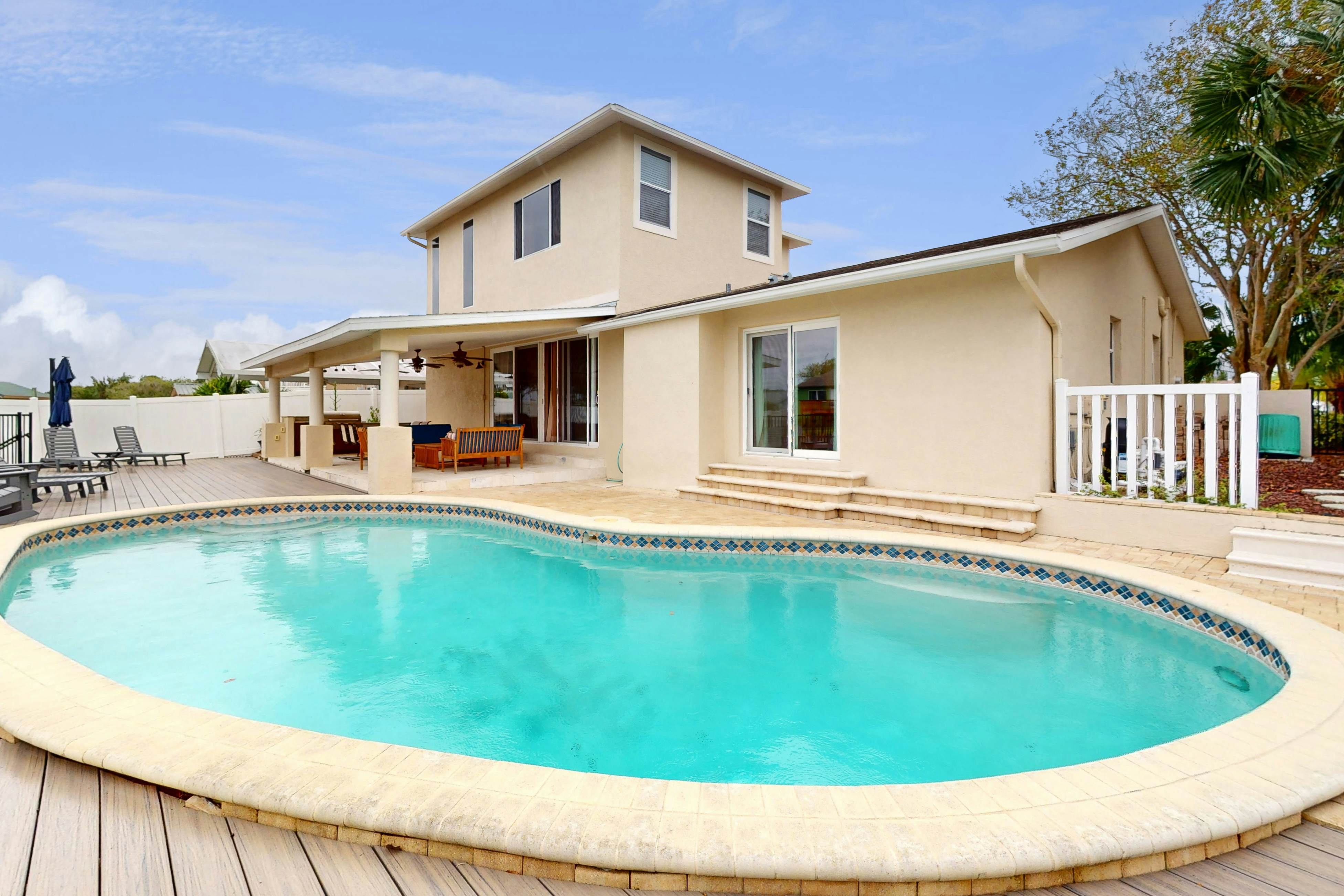 2,657-sq-ft upscale canal home with pool, dock & stunning main suite - dog-friendly