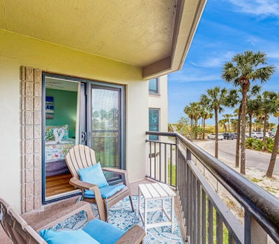 Contemporary gem on the Gulf Coast with balcony and WD walk to beach and shops
