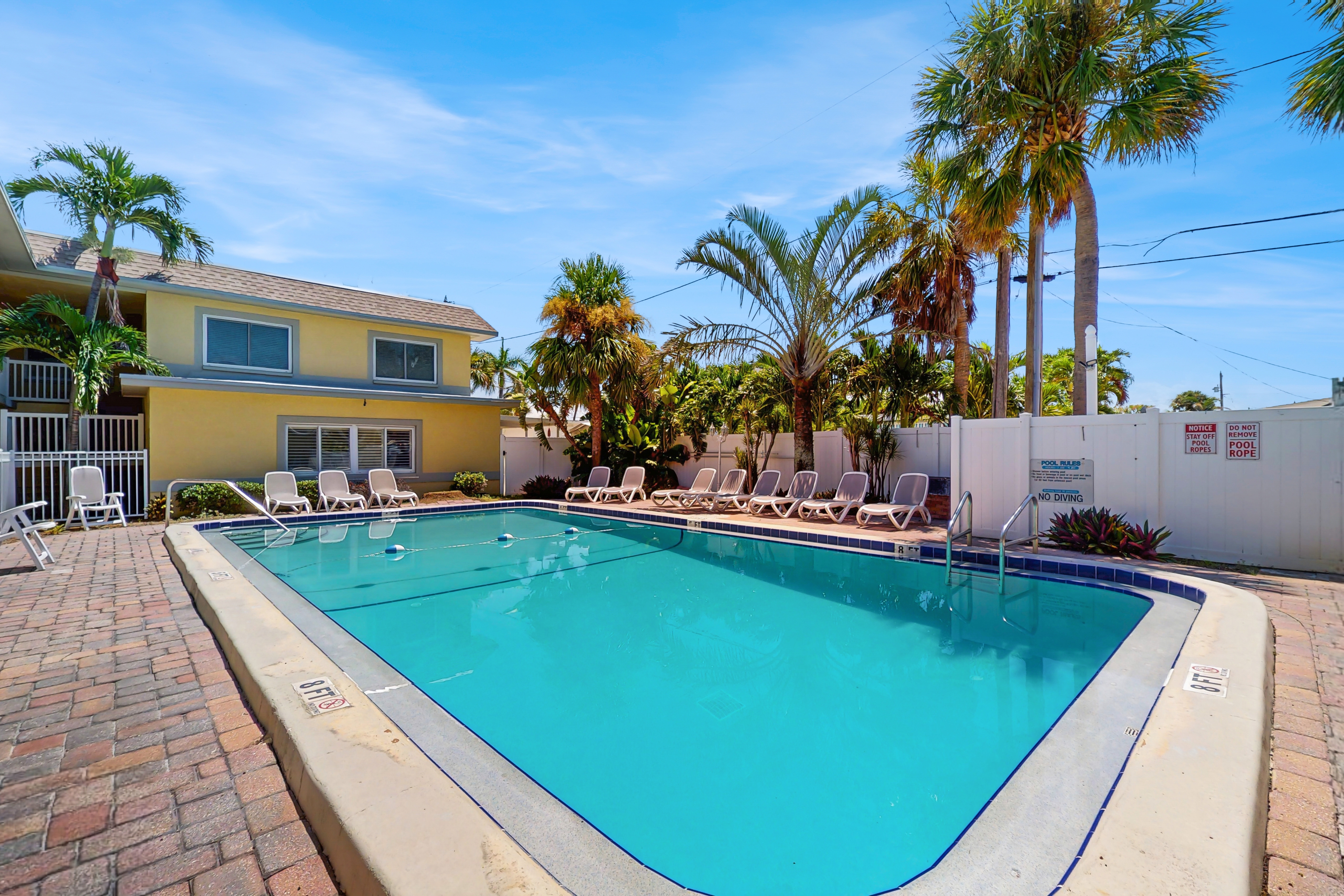 Ground floor getaway with a heated pool and central AC walk to the beach