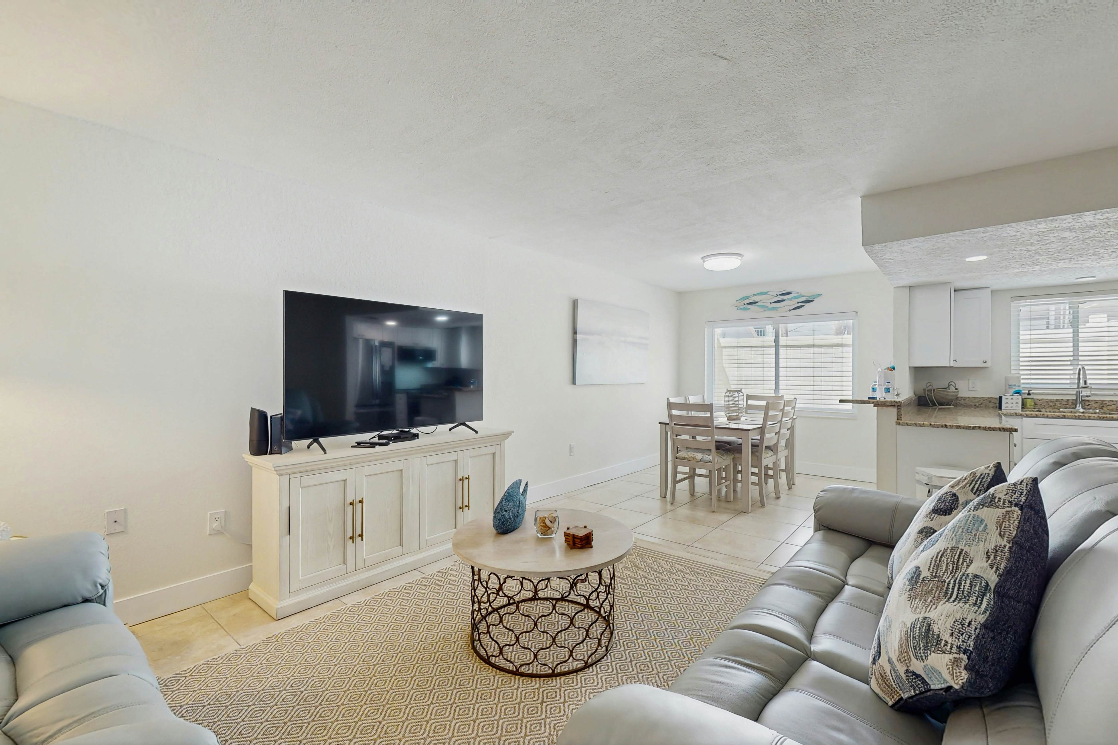 Ground-floor getaway with a heated pool & central AC - walk to the beach