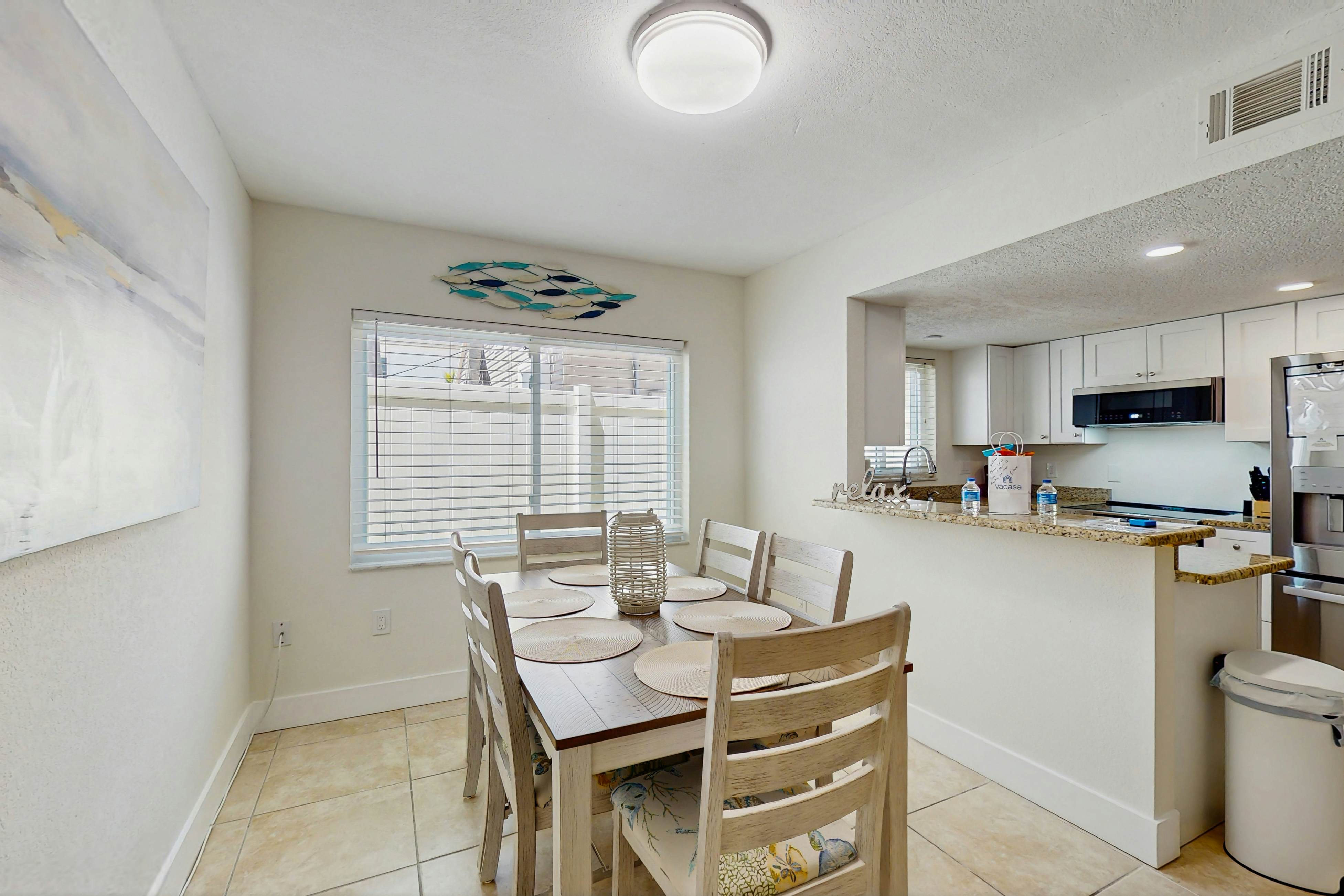 Ground-floor getaway with a heated pool & central AC - walk to the beach