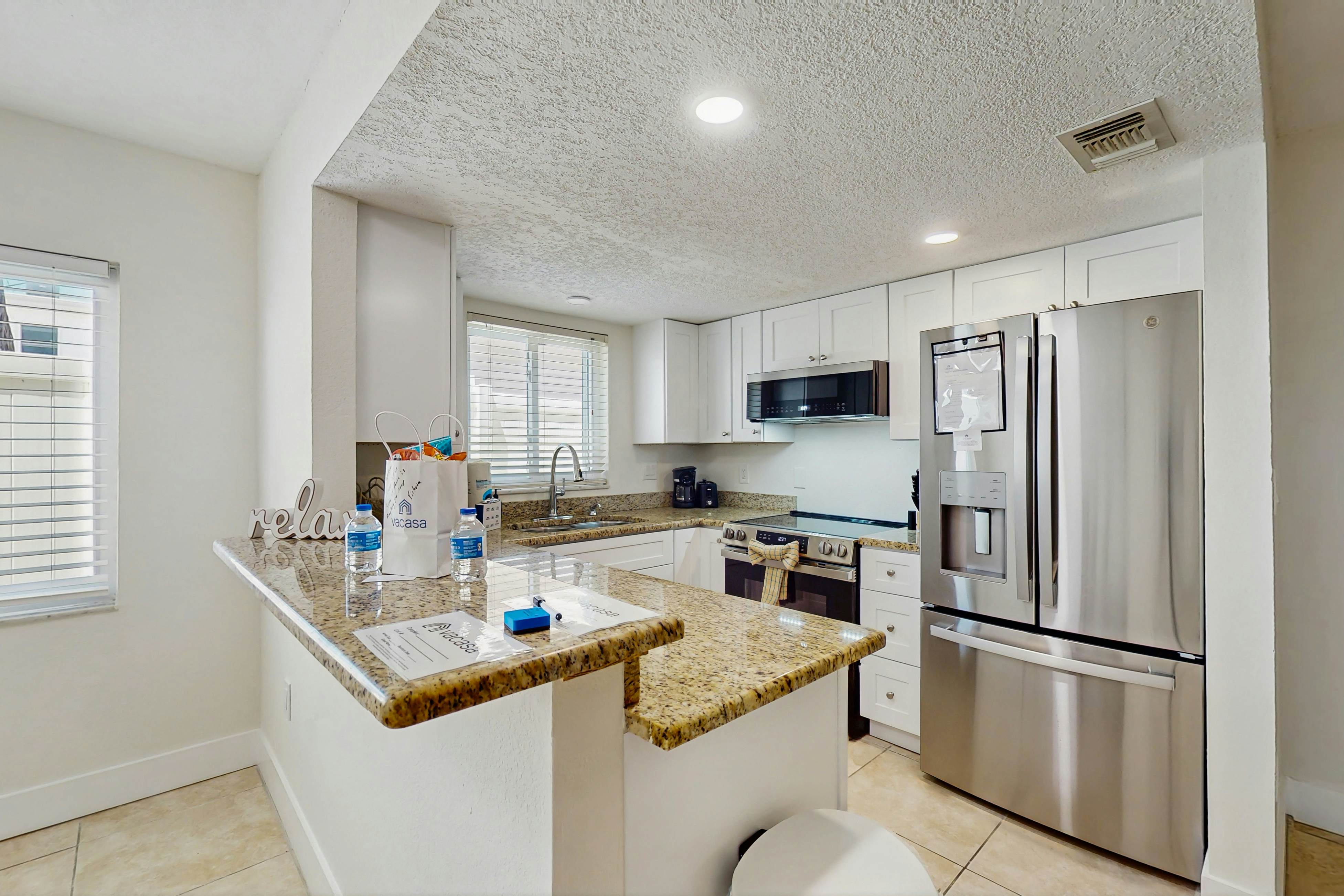 Ground-floor getaway with a heated pool & central AC - walk to the beach