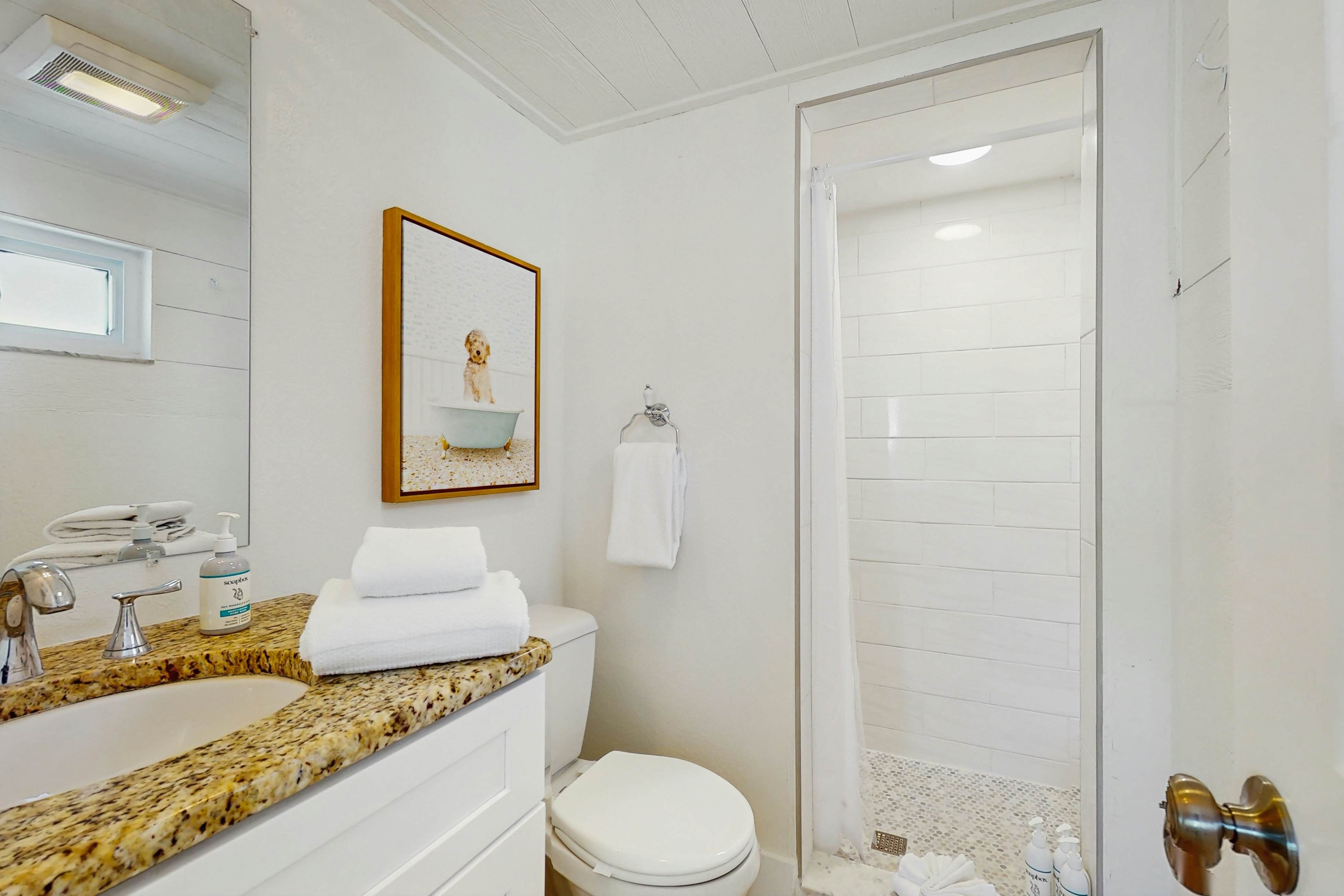 Ground-floor getaway with a heated pool & central AC - walk to the beach