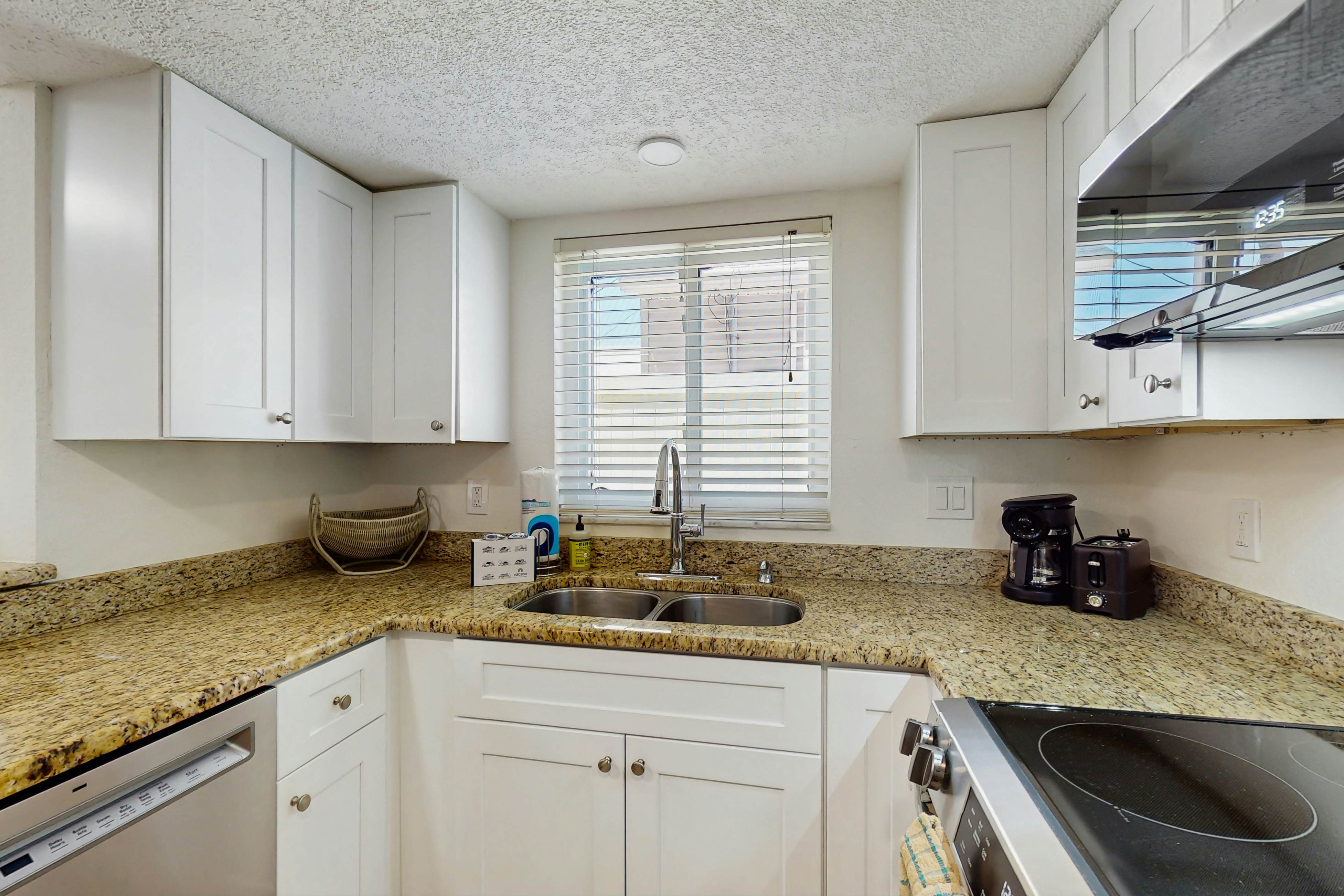 Ground-floor getaway with a heated pool & central AC - walk to the beach